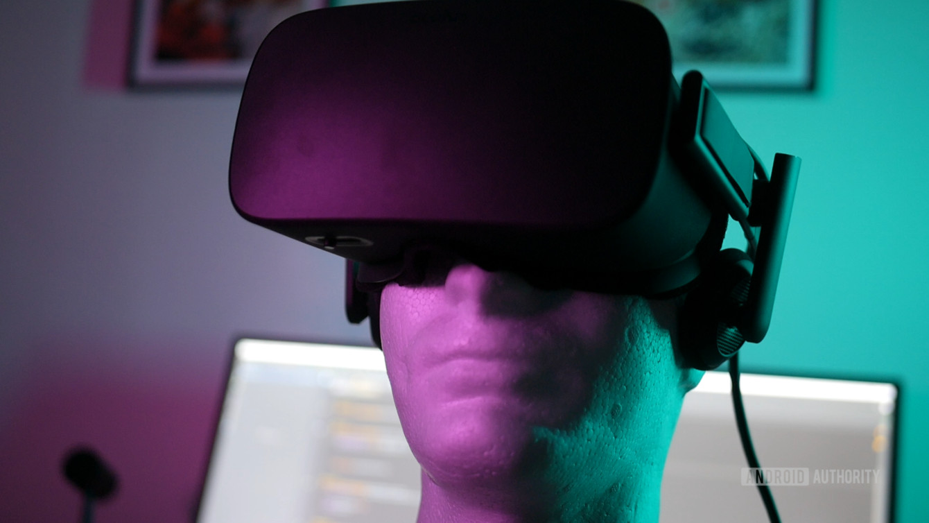 AA-VR-Dummy-Head-1340x754 A VR headset on a dummy head with purple and teal LED lighting.