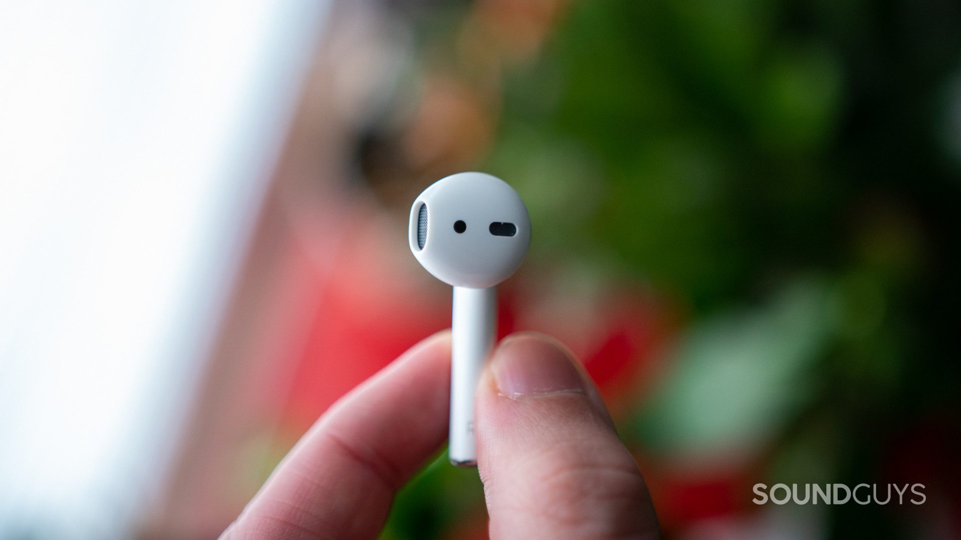 Airpods 2-5 Pictured is a single Airpod in hand.