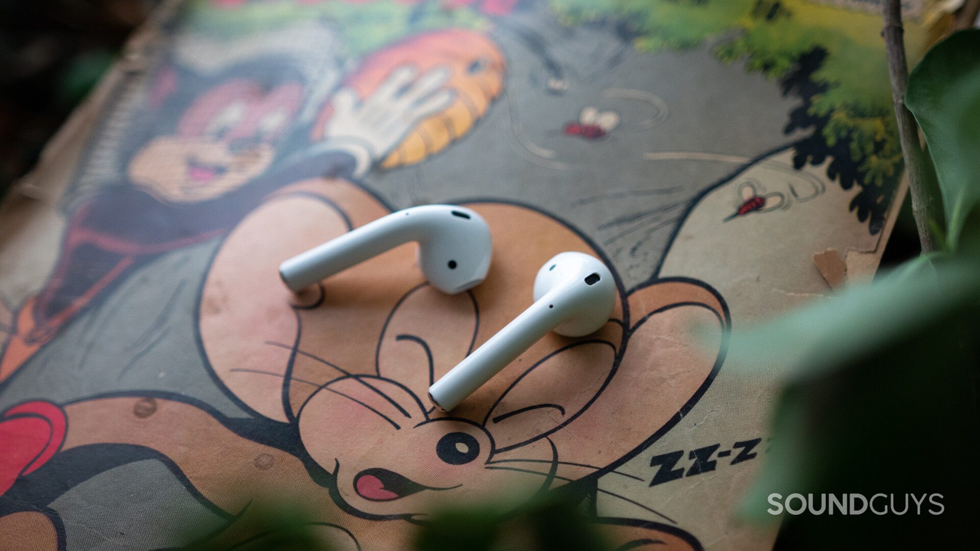 Airpods 2-6 The Apple Airpods (2019) on top of a comic.