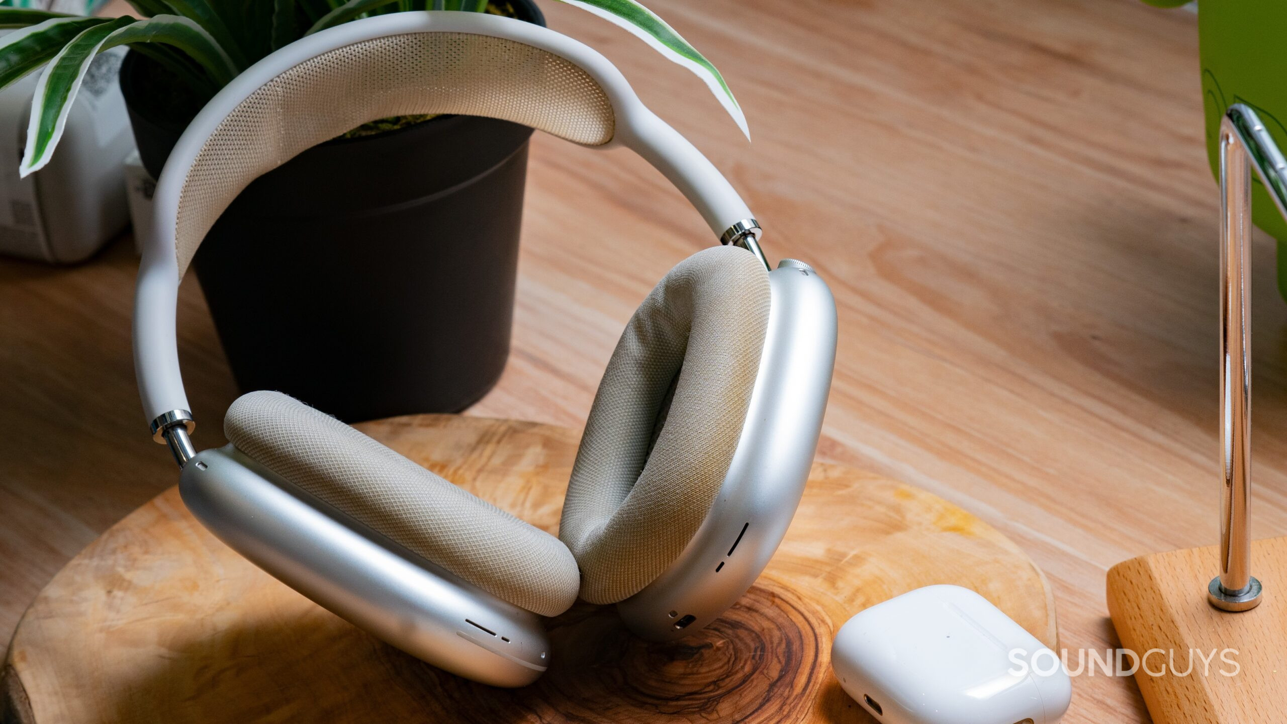 AirPods Max silver full studio The AirPods Max next to the AirPods Pro 2 case.
