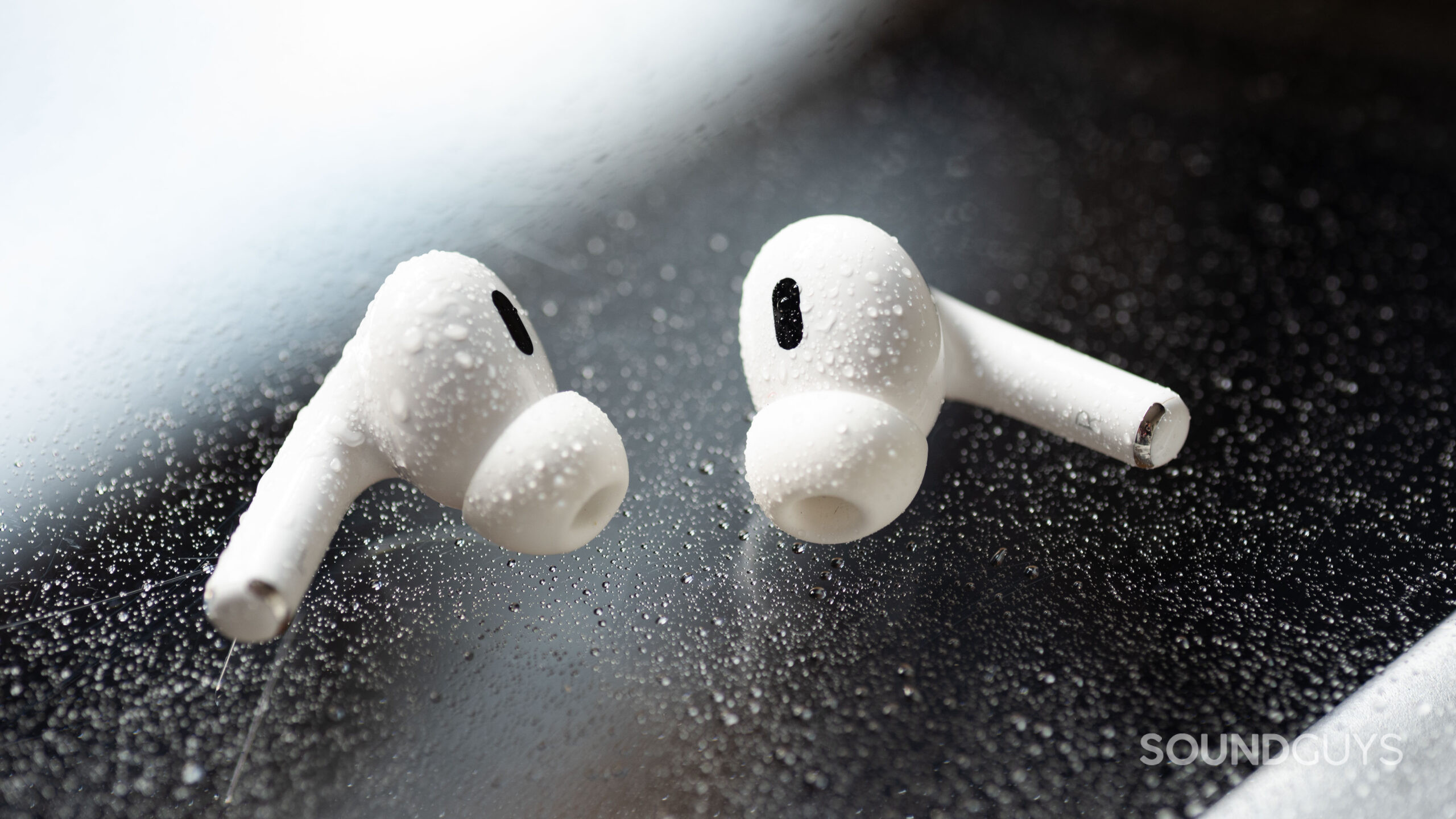 AirPods Pro 2nd generation water The AirPods Pro 2 with water droplets on them.