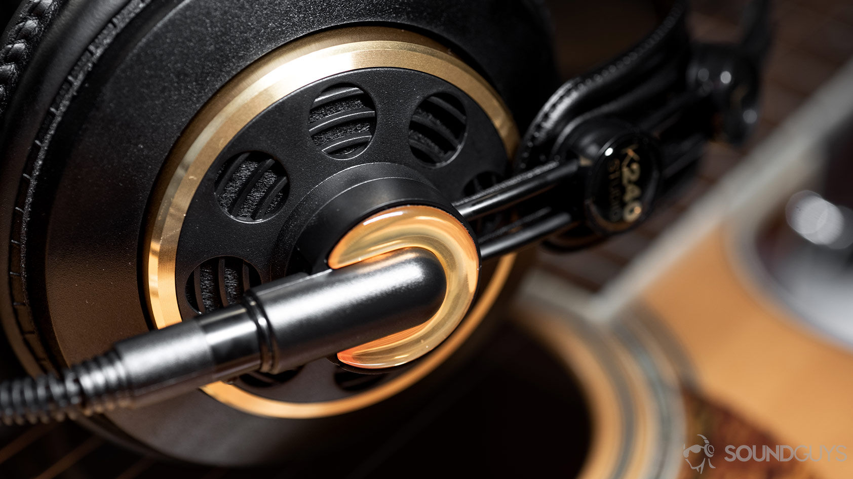AKG K240-open headphones ear cup A photo of the AKG K240 Studio semi-open headphones with the left ear cup in focus.