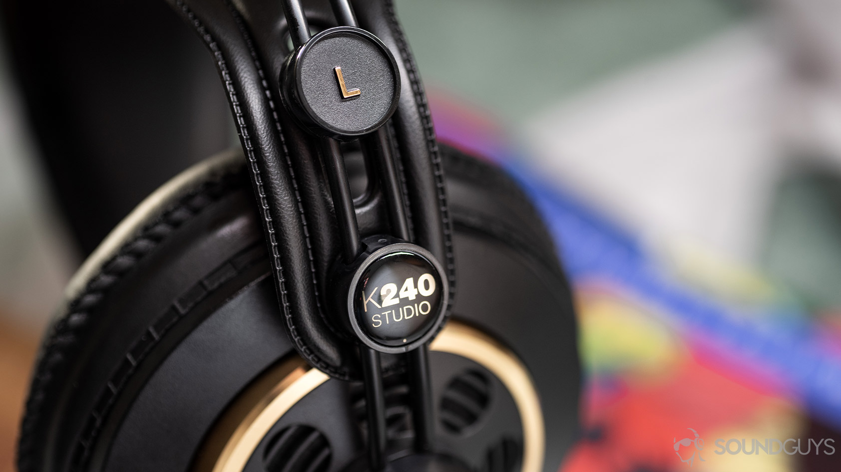 AKG K240-open headphones headband suspension adjustment sliders A photo of the AKG K240 Studio semi-open headphones with the slider mechanism in focus.