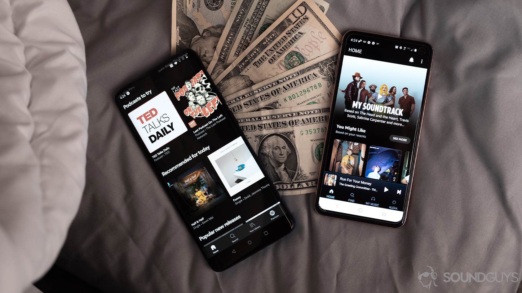 Amazon Music HD vs Spotify Premium-music streaming services money Spotify Premium vs Amazon Music HD on two smartphones laid atop cash.