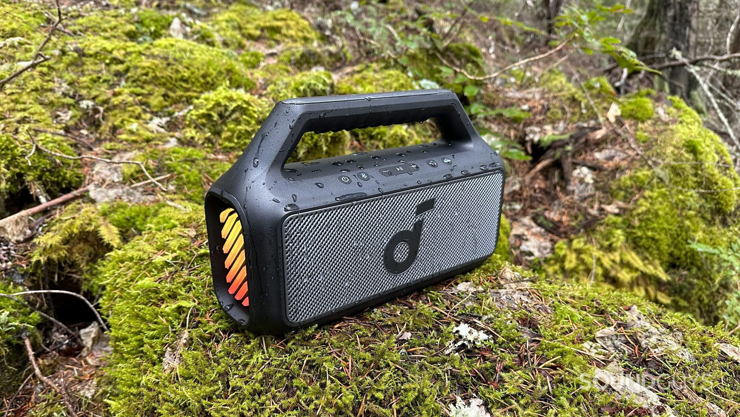 Anker Soundcore Boom 2 #1 Side view of the Anker Soundcore Boom 2 on a mossy rock.