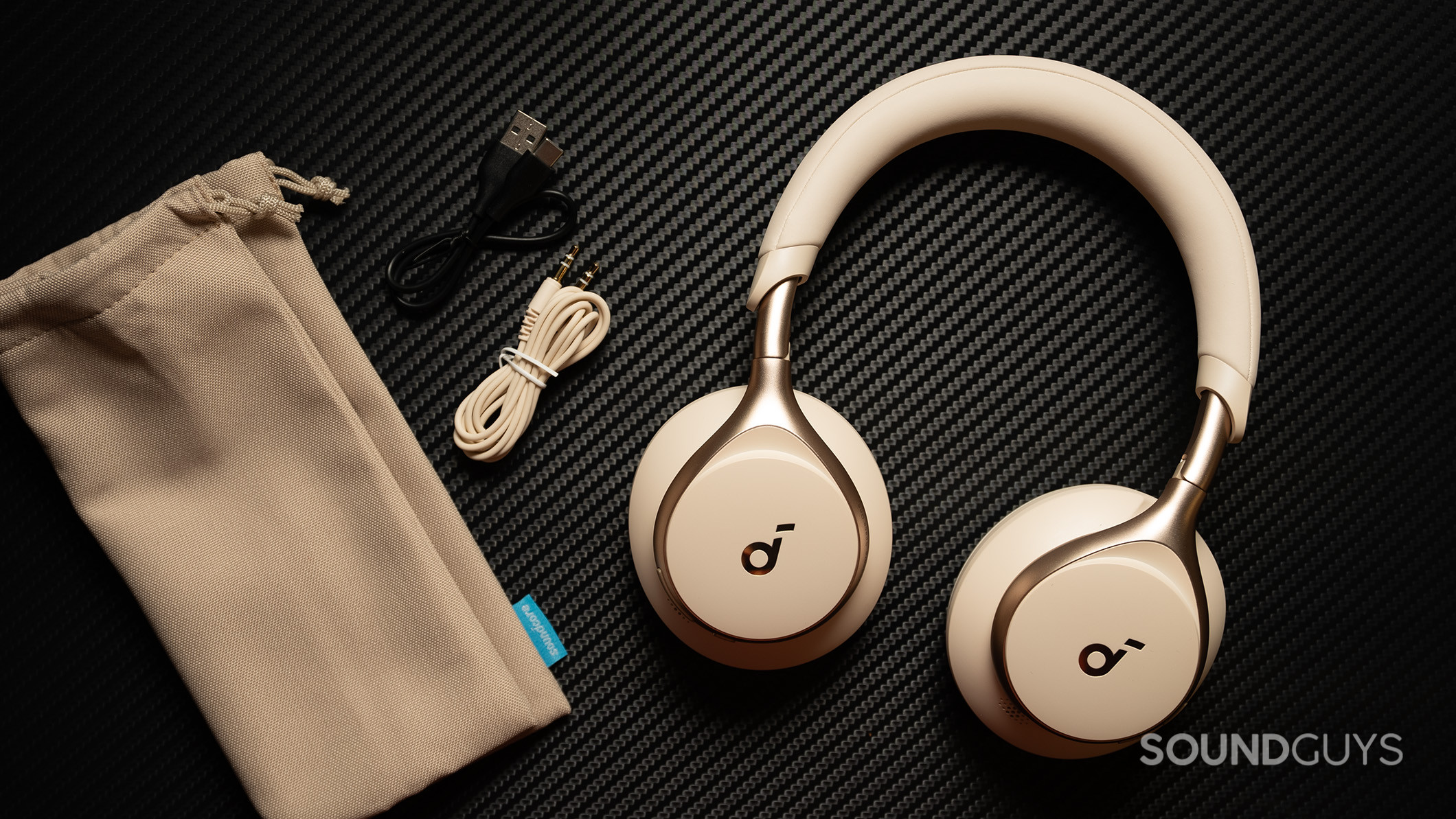 Anker Soundcore Space One accessories Anker Soundcore Space One headphones next to cloth case and cables.
