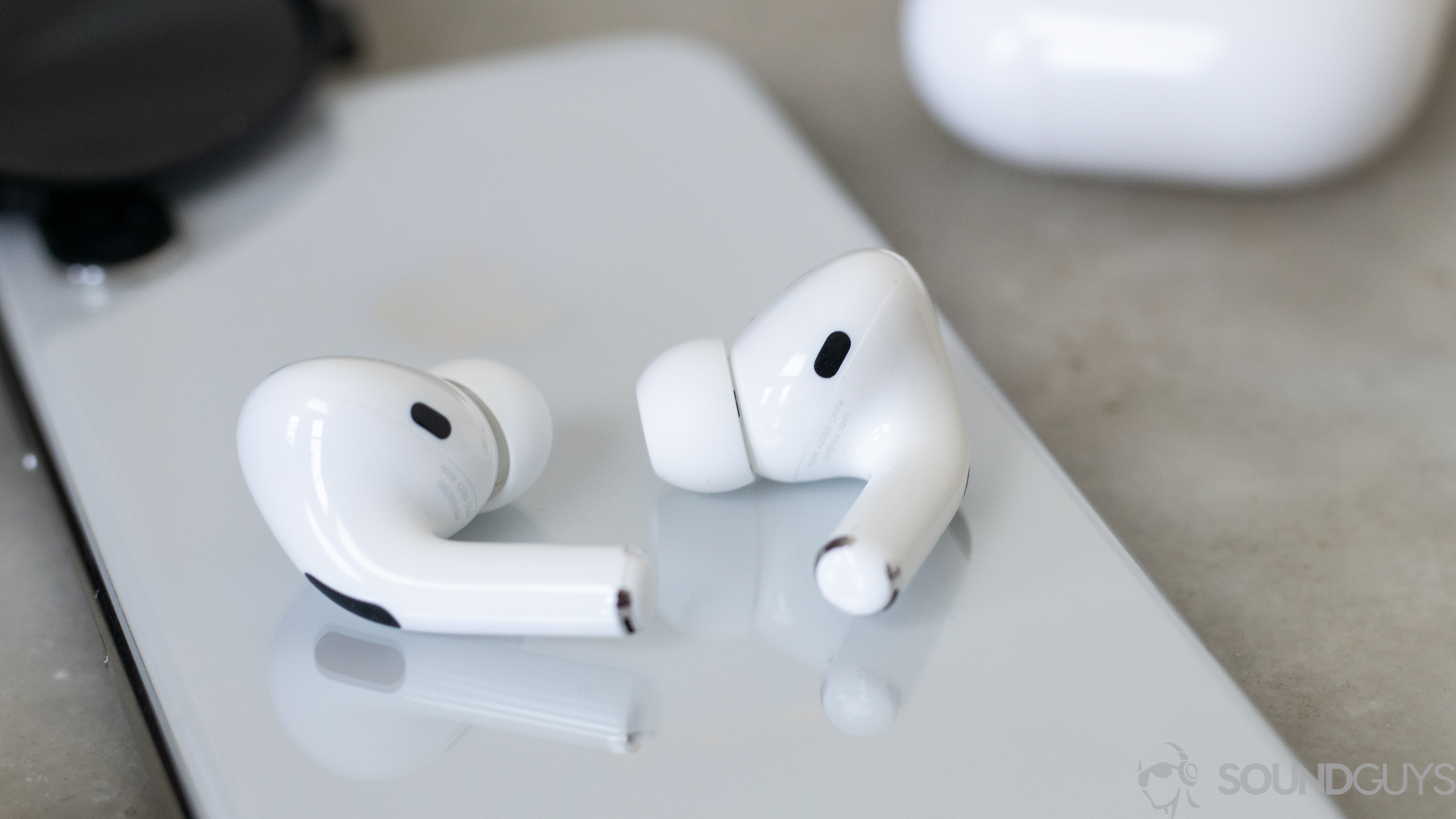Apple AirPods Pro-14 The Apple AirPods Pro noise canceling true wireless earbuds rest on a smartphone.