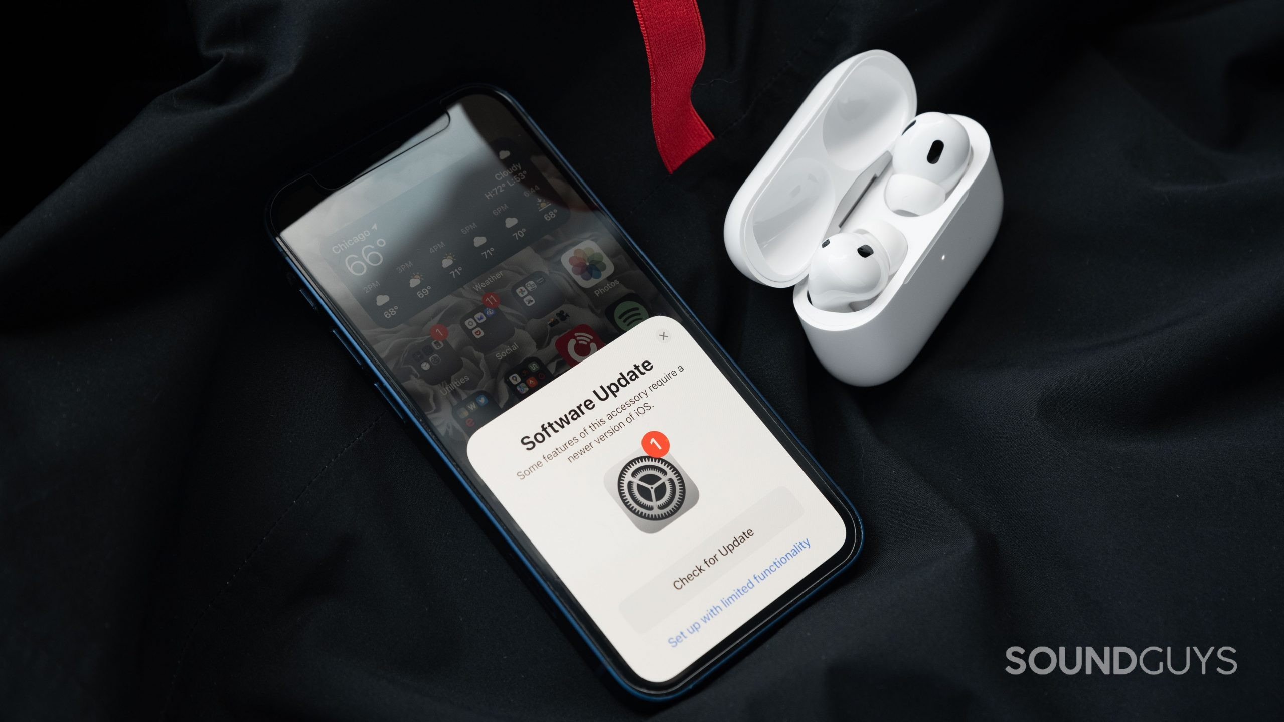 Apple AirPods Pro (2nd generation) true wireless earbuds setup pop up iphone update The Apple AirPods Pro (2nd generation) case is open and contains the earbuds next to an iPhone 12 mini, which prompts the user to update to iOS 16.