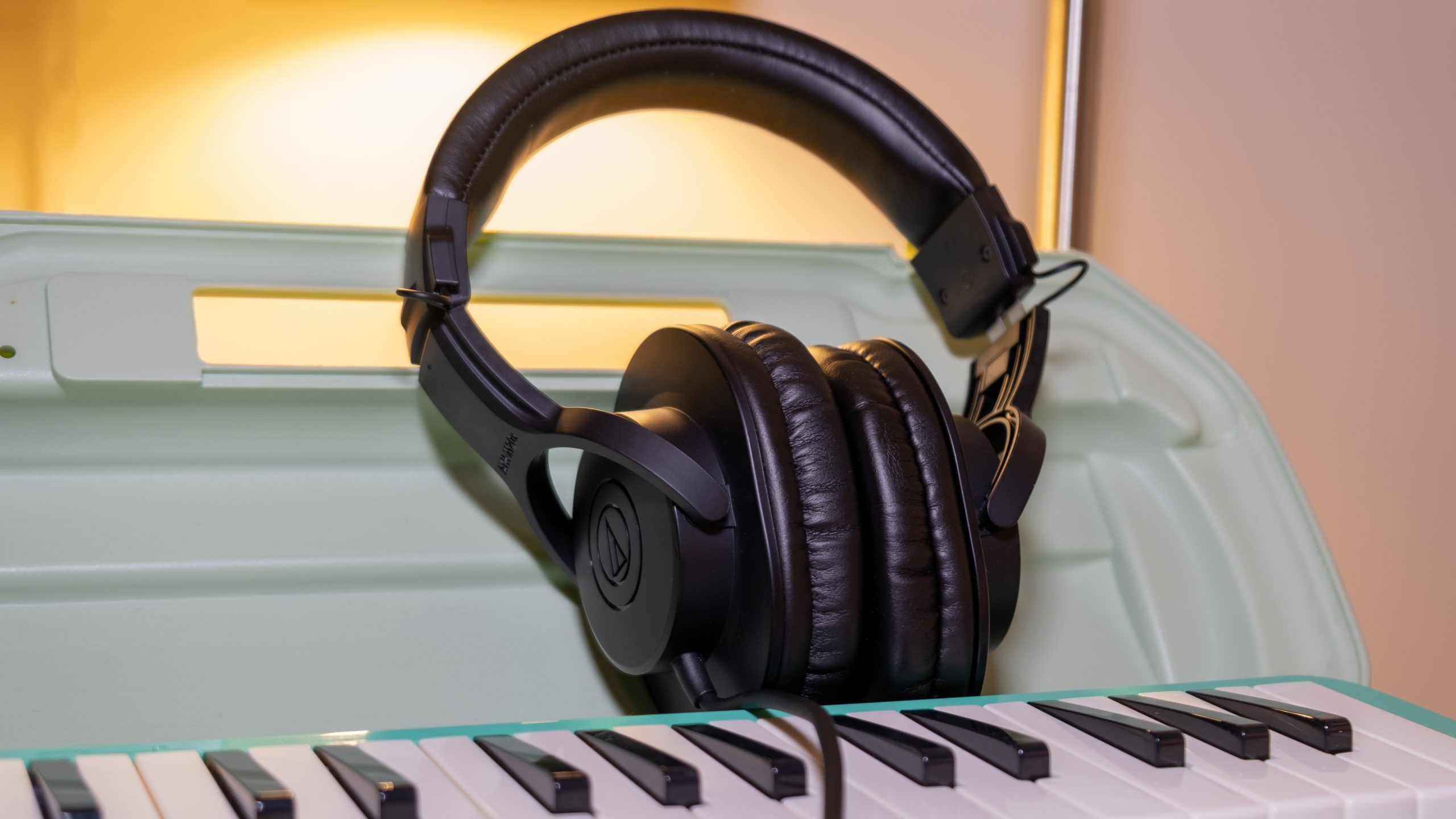 audio-technica-ath-m20x-upright The Audio-Technica ATH-M20x stands up on a melodion case.