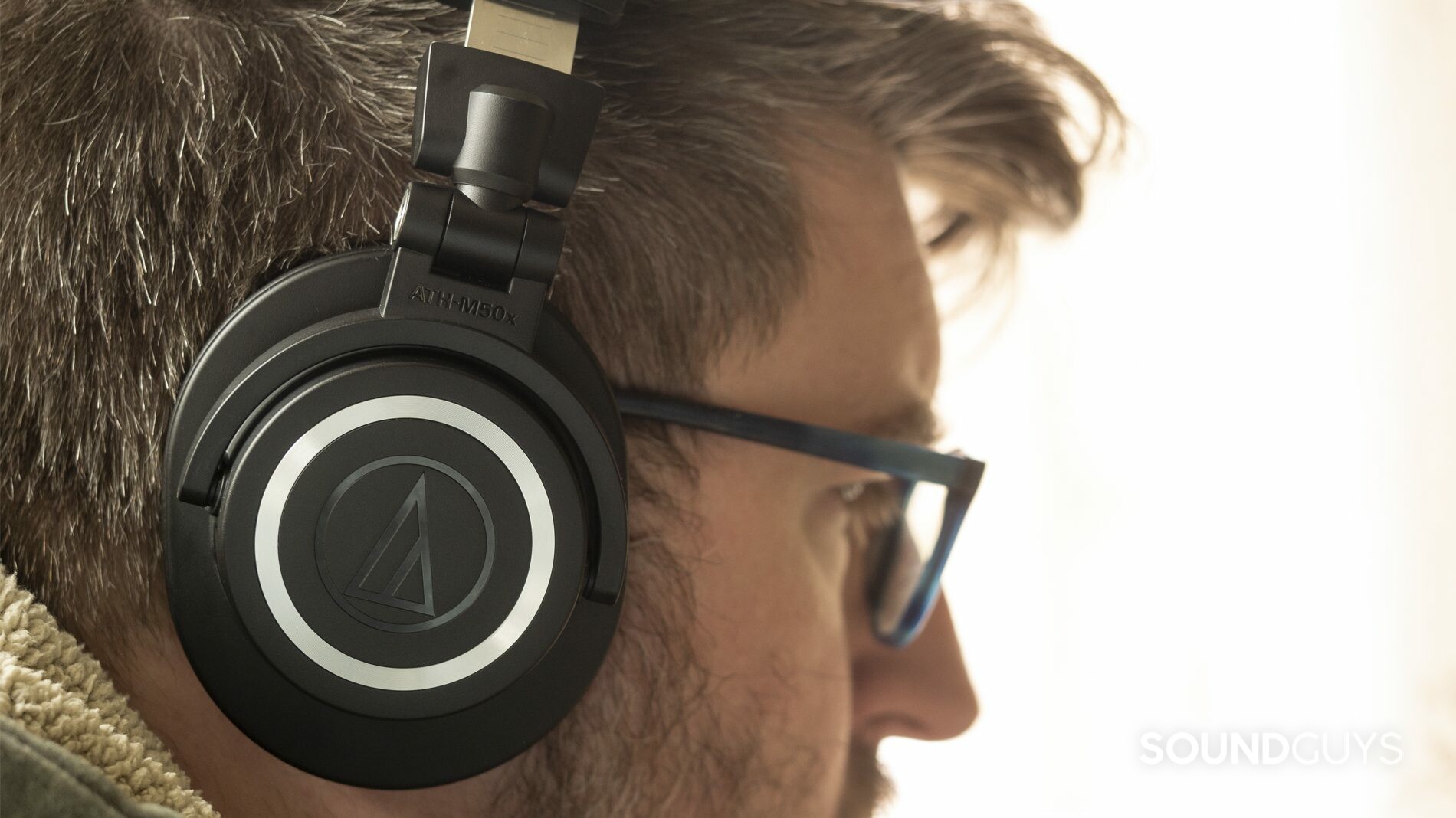 audio-technica-ath-m50xbt-wear A photo of the Audio-Technica ATH-M50xBT on a man's head.