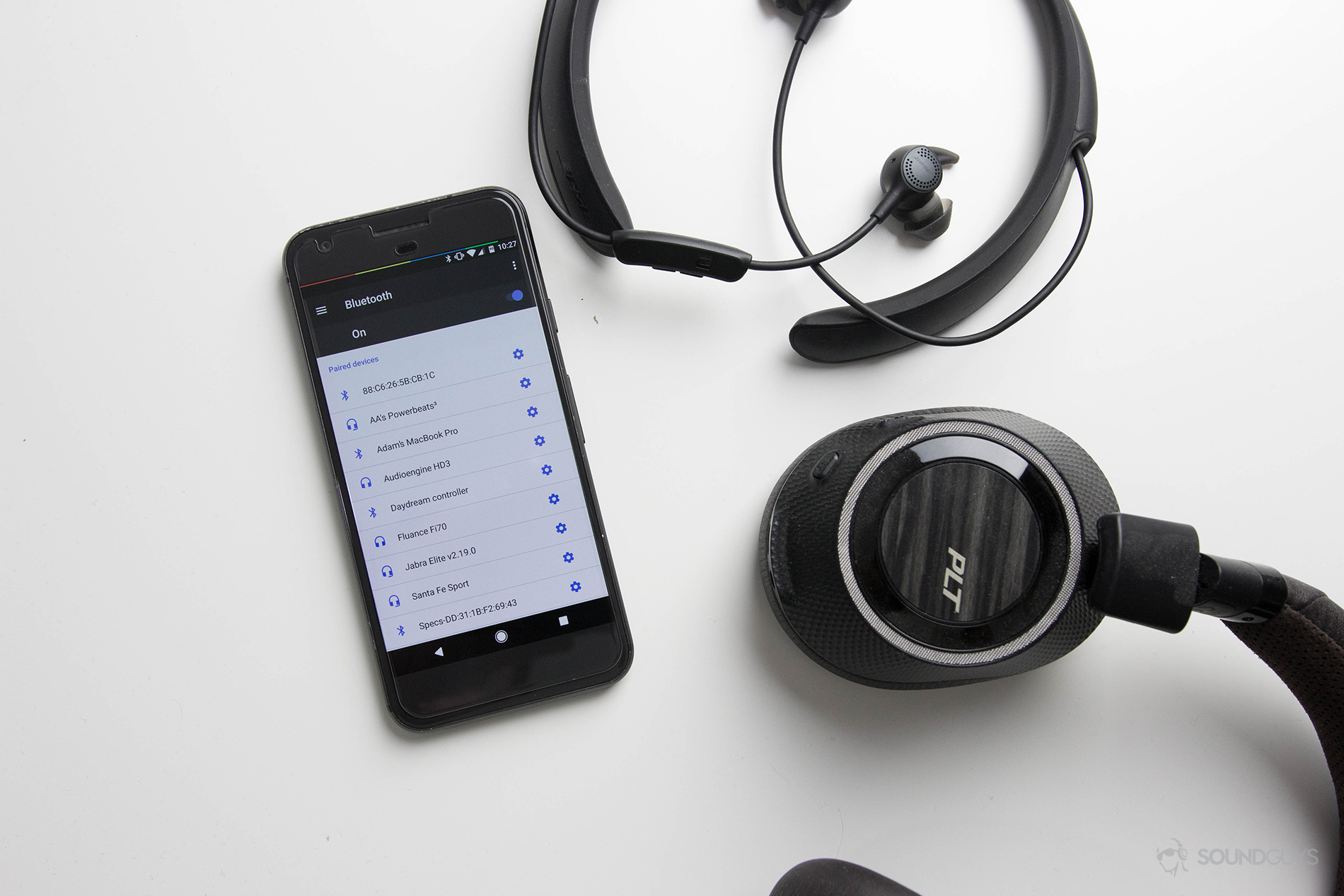 Bluetooth headphones A picture containing wireless headphones, wireless earbuds and a phone