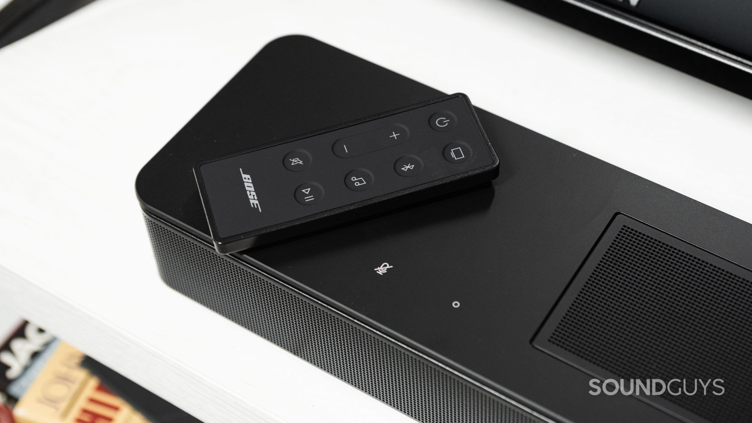 Bose Smart Soundbar 600 remote control The remote for the Bose Smart Soundbar 600 rests on top of the speaker.