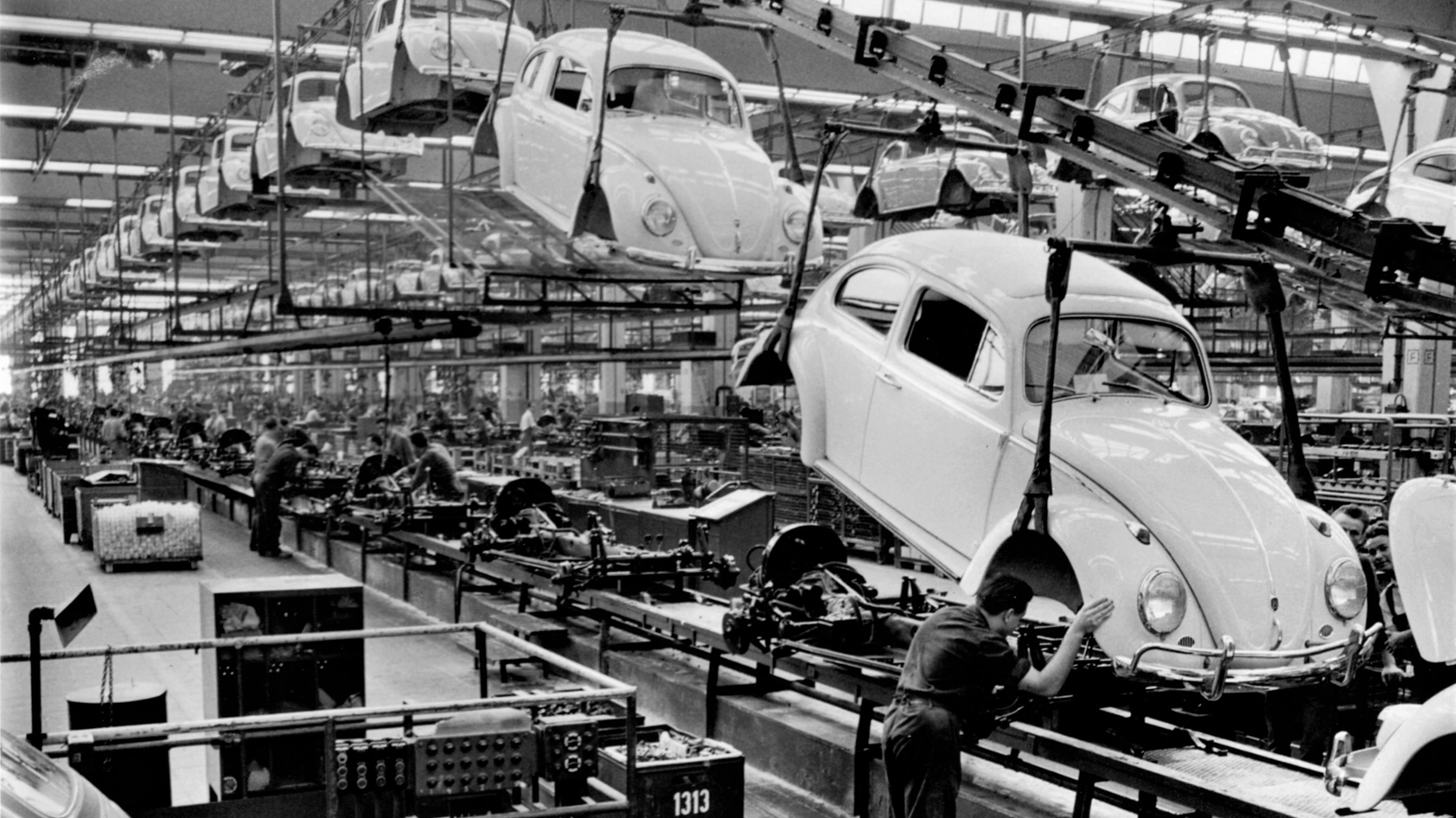 burn-in-assembly-line-vw Headphone burn-in isn't real: Black and white image of car manufacturing plant.