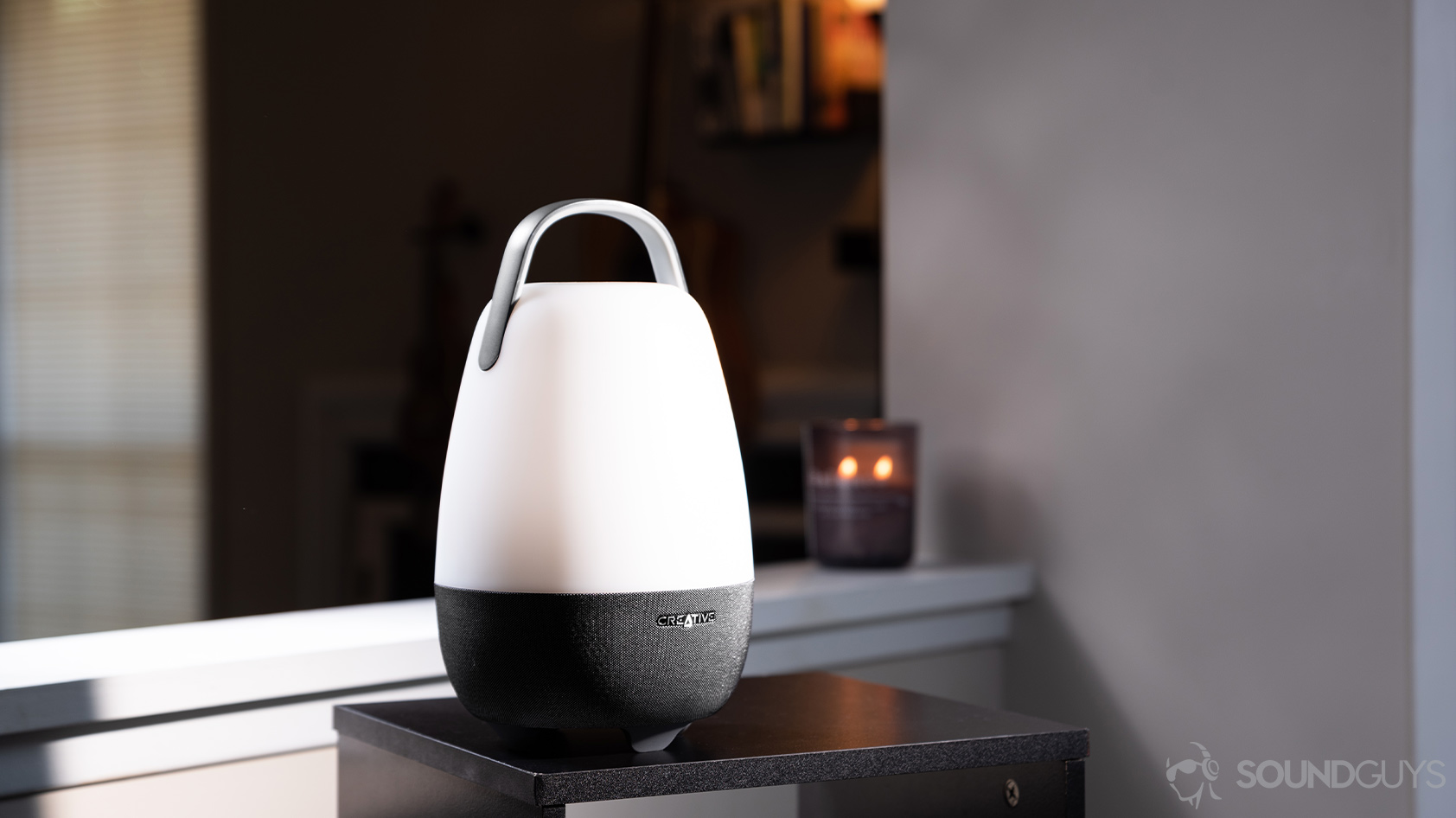Creative_Nova-1_speaker full living room The speaker in a living room setting with a candle lit in the background.