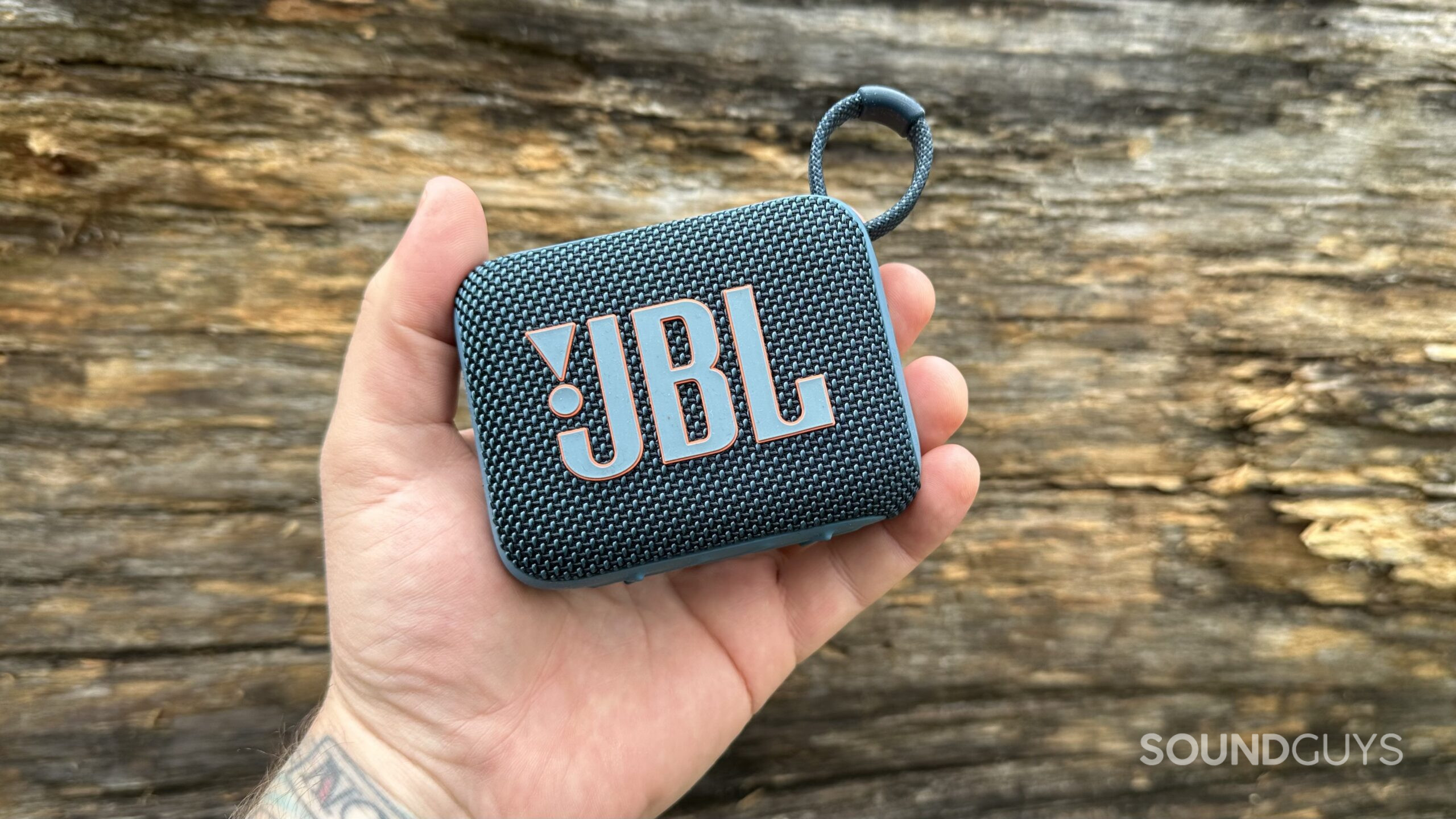 JBL Go 4 in hand A JBL Go 4 in the palm of a hand.