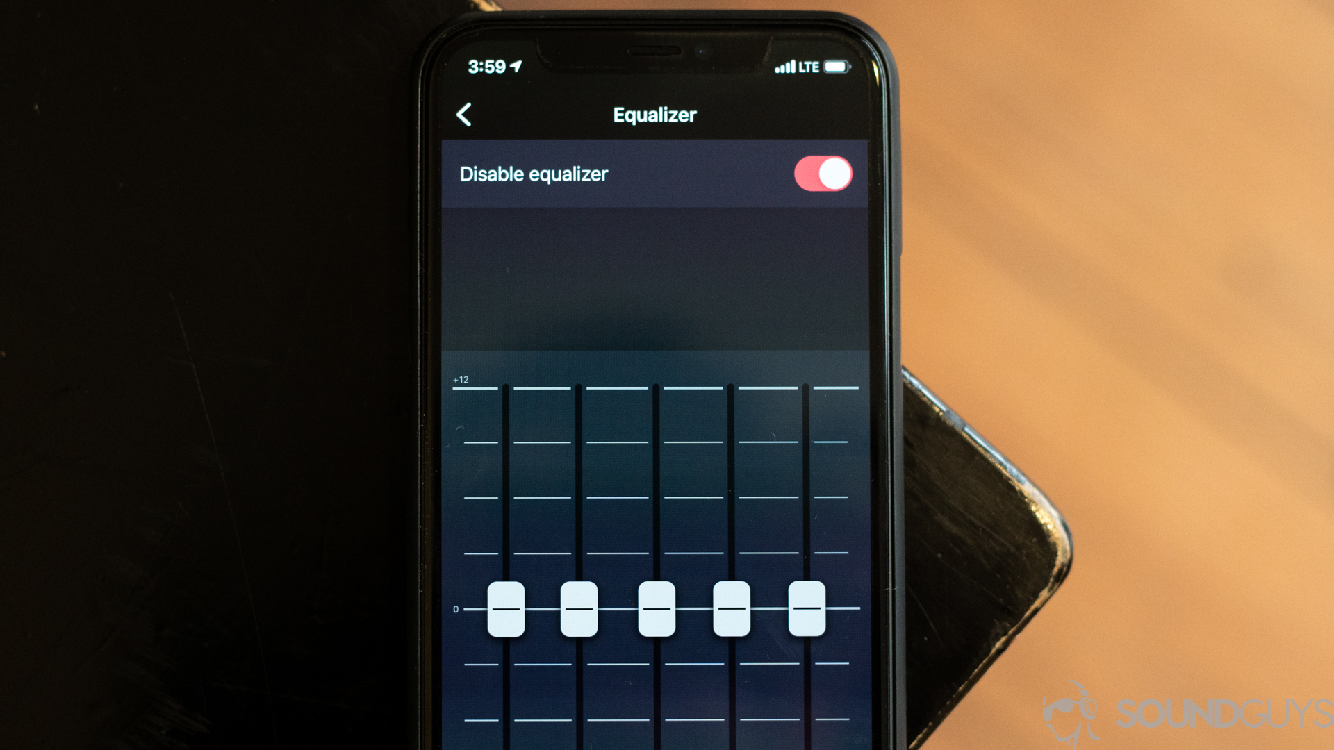 Deezer app equalizer on iOS Pictured is an iPhone 11 Pro on a desk with the Deezer equalizer on the screen