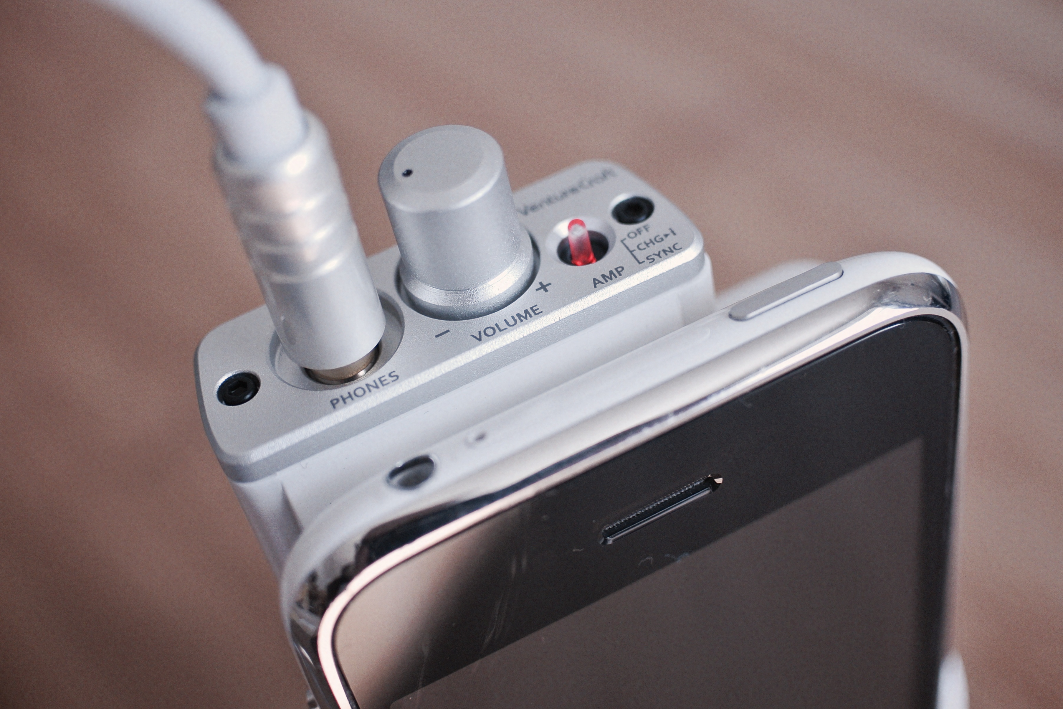 do-you-need-an-amp-headphone-amp-phone A photo of a headphone amplifier attached to a smartphone, shot by Flickr user mujitra.