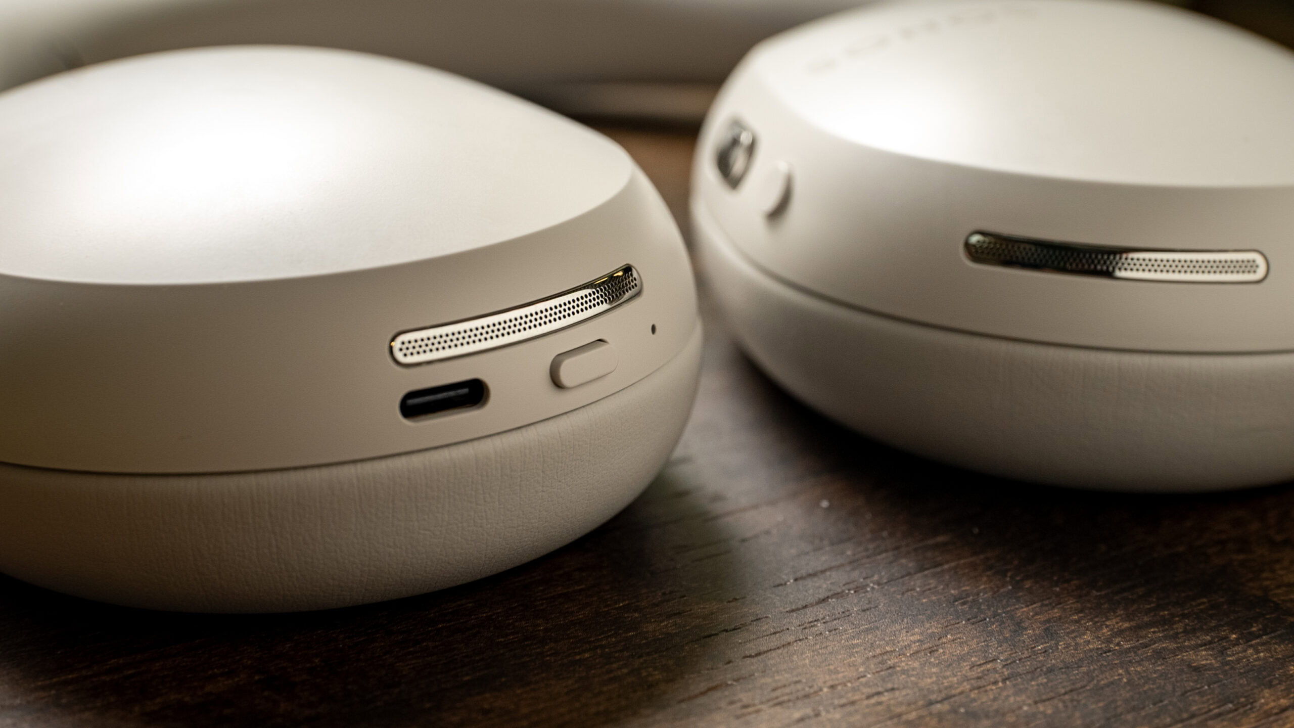 Sonos Ace USB-C port power button close-up Close-up photo of the microphone array, USB-C port, and power/Bluetooth pairing button of the Sonos Ace headphones