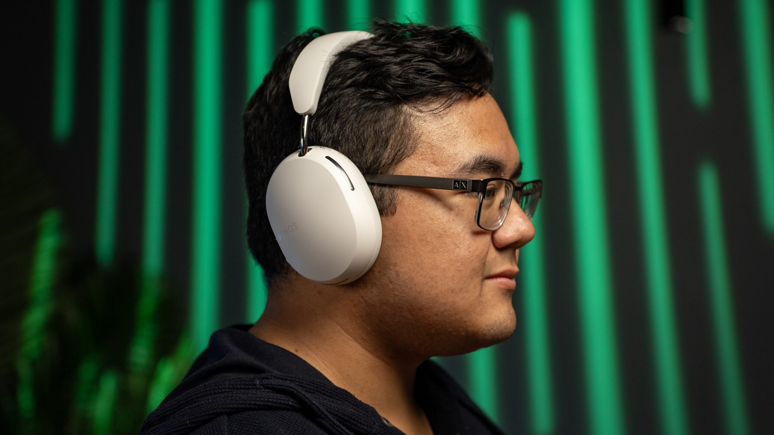 Sonos Ace headphones wearing A side profile photo of a man wearing the Sonos Ace headphones