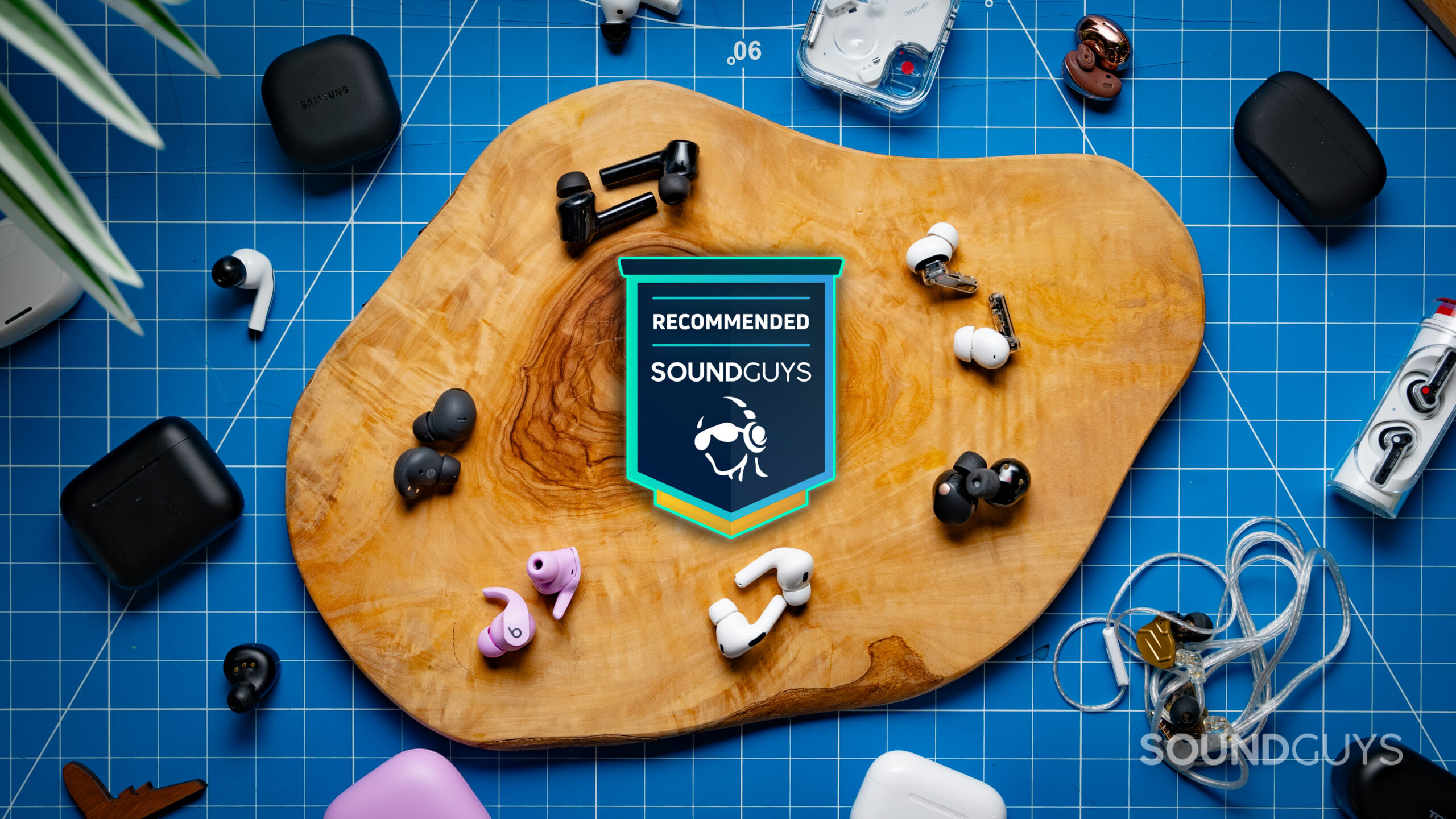 Earbuds Best List Photo multiple pairs of earbuds surround the SoundGuys recommended badge