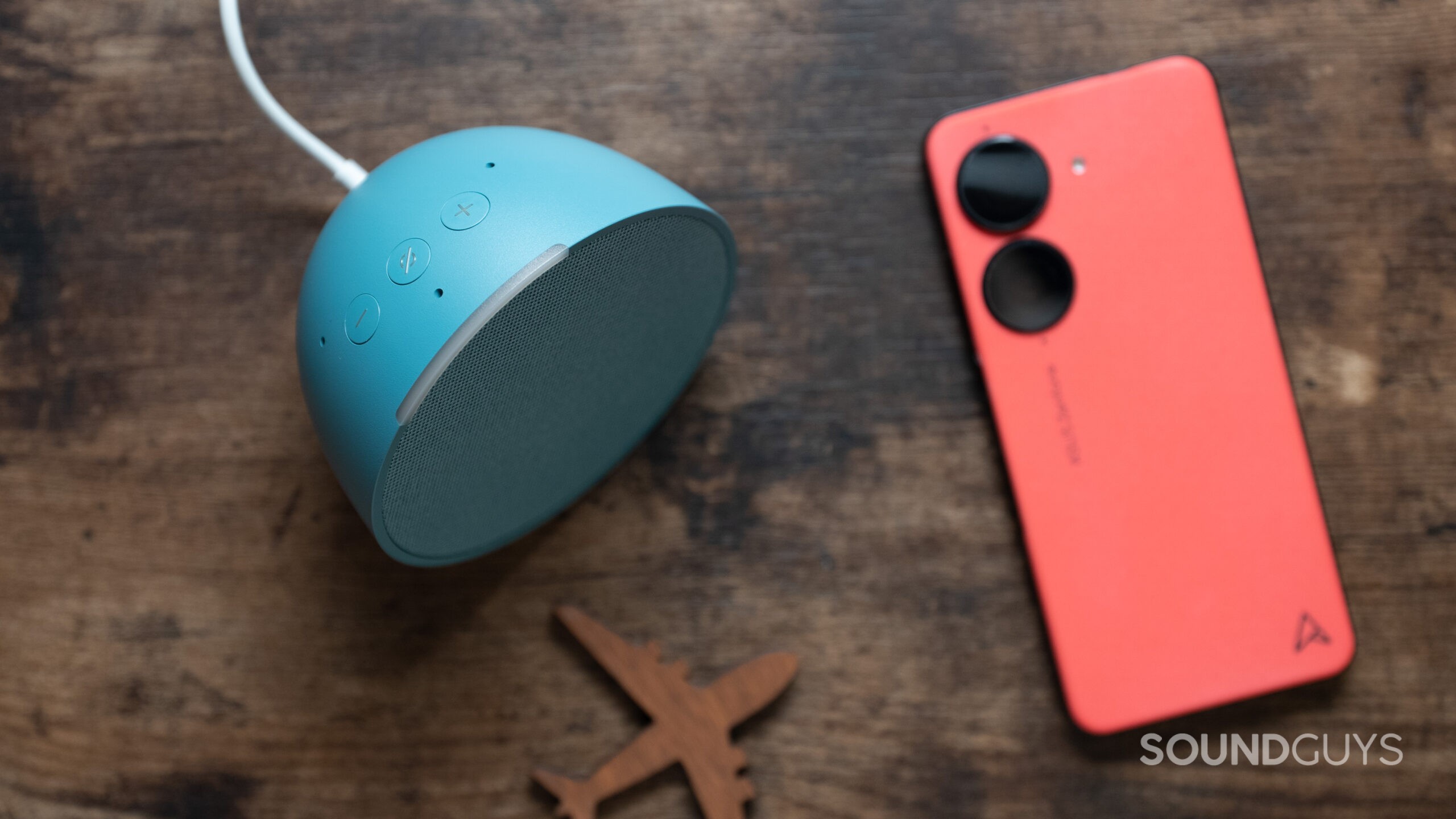 Echo-Pop-next-to-phone The Amazon Echo Pop next to a phone on a table.