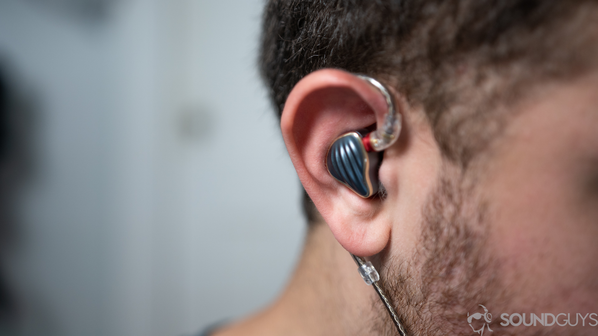 Wearing the Fiio FH5 in-ears An image of a man wearing the Fiio FH5 in-ear monitors.