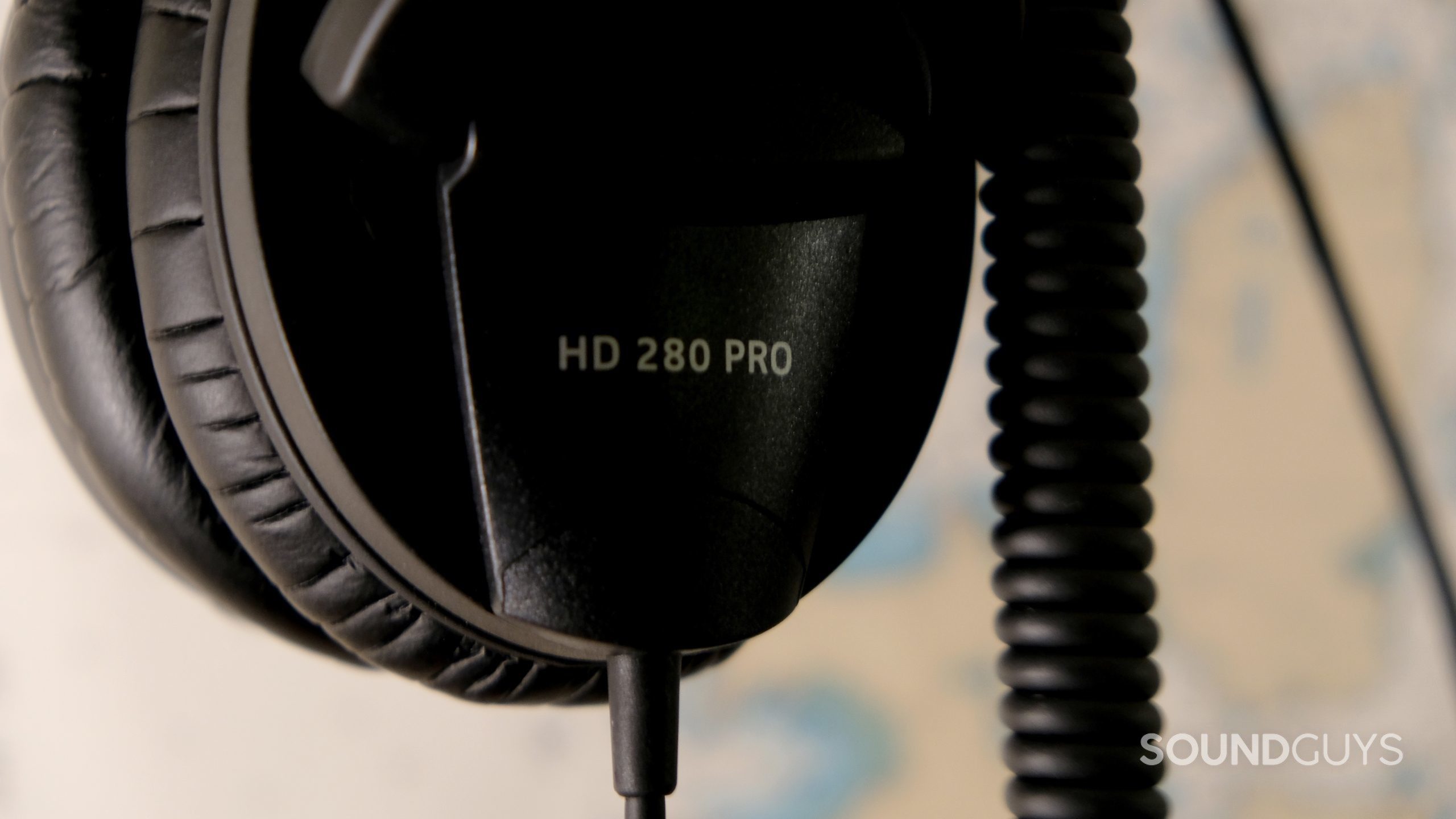 Sennheiser hd 280 pro close up The Sennheiser HD 280 Pro studio headphones logo and coiled cable.