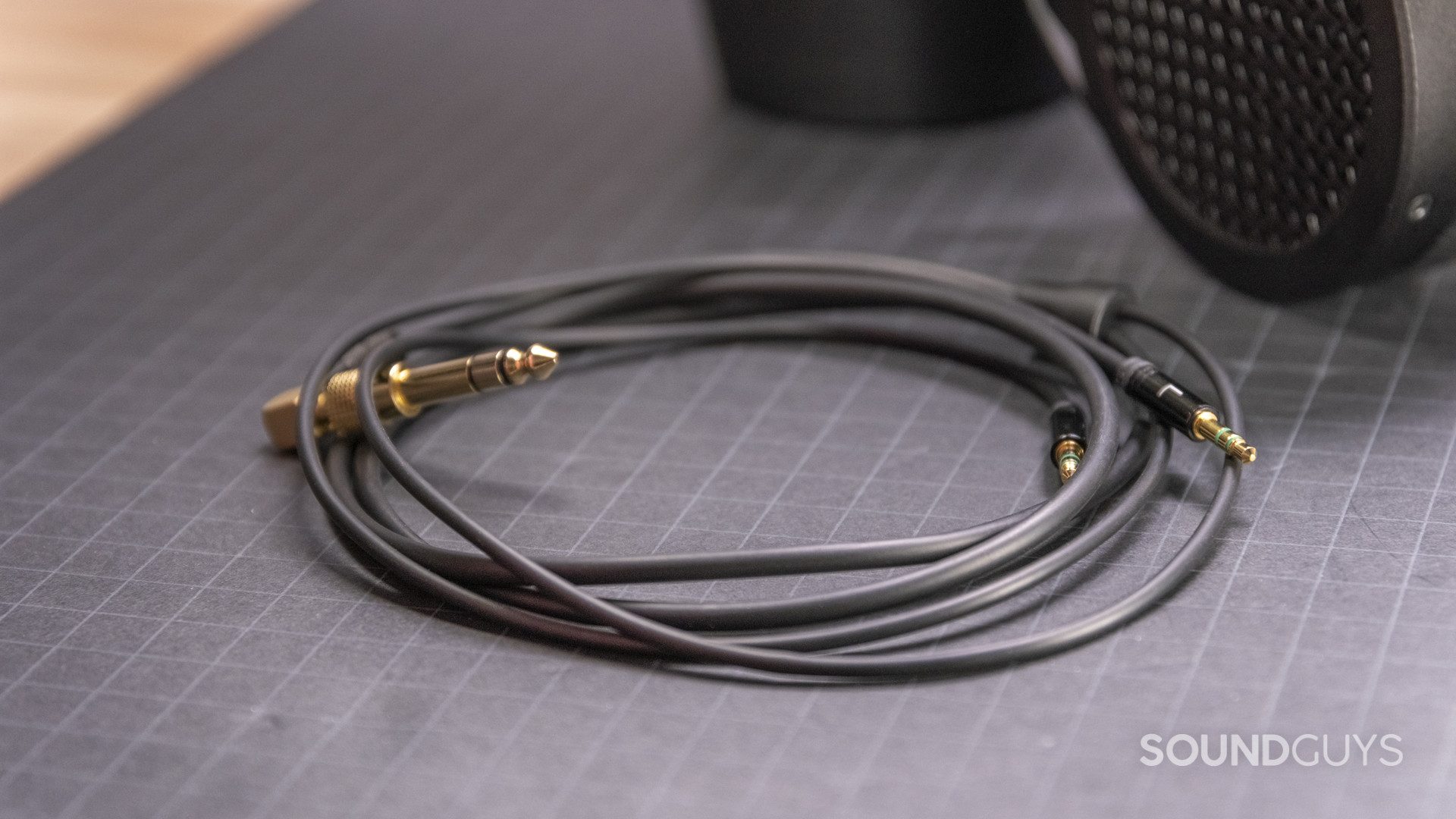 hifiman-sundara-cable The cable that comes with the HiFiMan Sundara rests on a gridded surface.