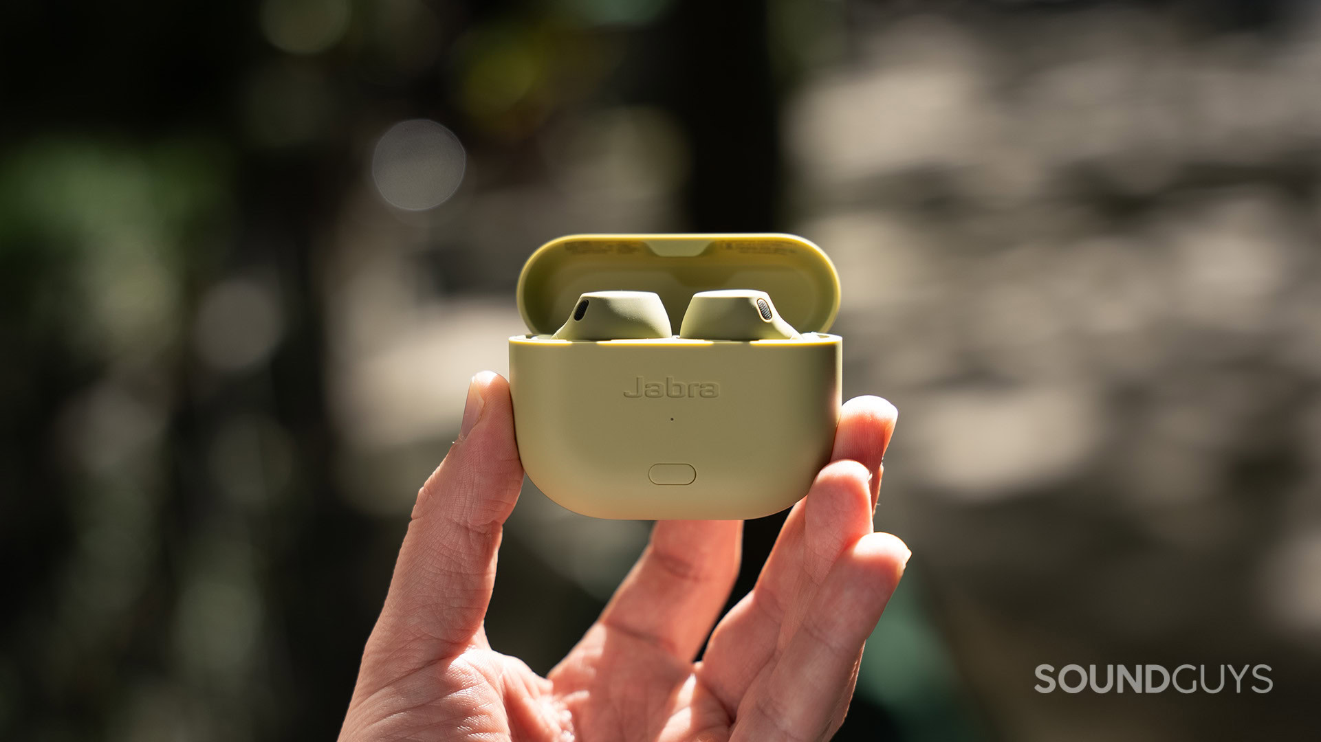 Jabra Elite 8 Active Gen 2 held outside A hand holds the Jabra Elite 8 Active Gen 2.