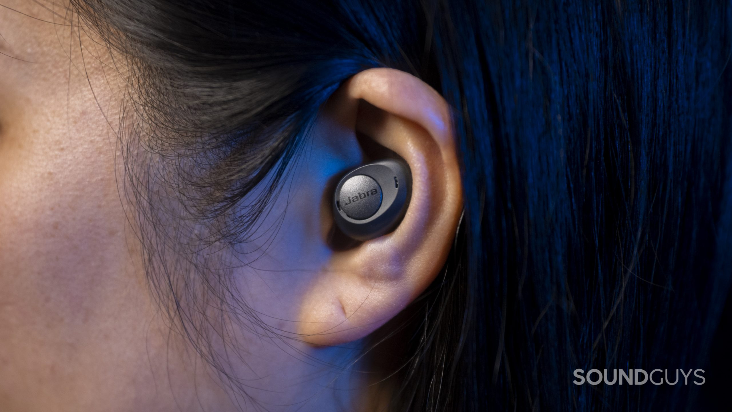 Jabra Enhance Plus hearing aid hearable ear straight on The Jabra Enhance Plus hearing aid hearable in a woman's left ear.