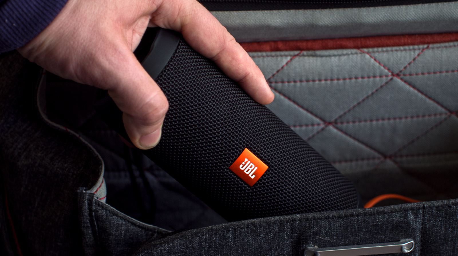 jbl-charge-3-jbl-flip-3-portability-bag A photo of the JBL Flip 3 put into a bag.