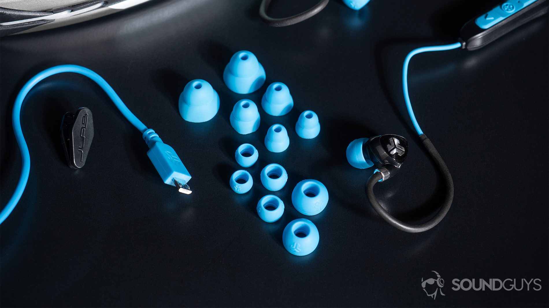 JLab_Fit 2.0-1 JLab Fit Sport Wireless: The earbuds and all of its inclusions: six pairs of spare ear tips, a shirt clip, and micro-USB cable.