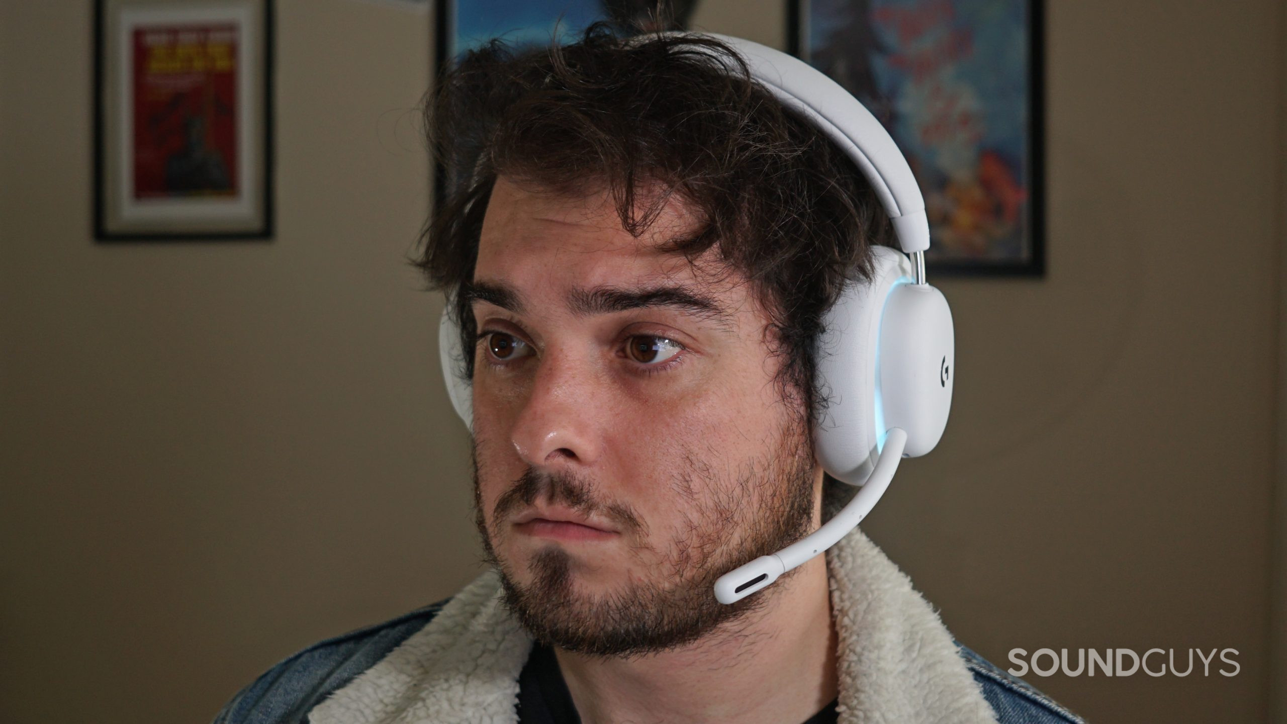 Logitech-G735-headshot A man sits at a PC wearing the Logitech G735.