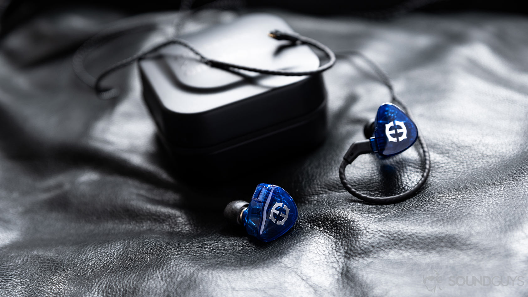 Massdrop x Empire Ears Zeus-premium IEMs blue carrying case A photo of the Massdrop x Empire Ears Zeus earbuds in blue in front of the included carrying case.