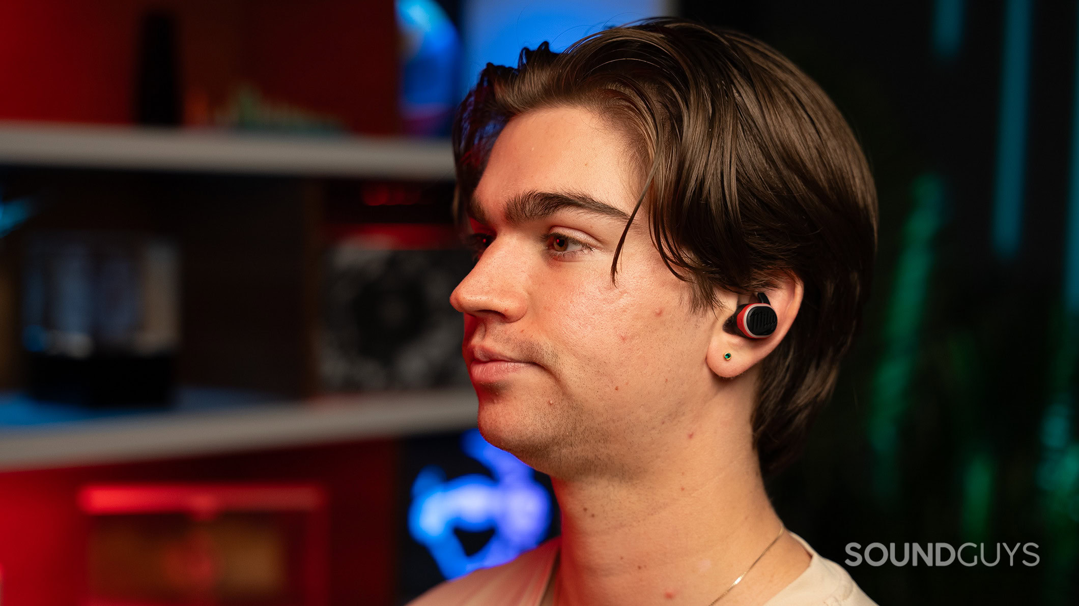 Milwaukee earbuds on man looking left A man wearing the Milwaukee earbuds looking left.