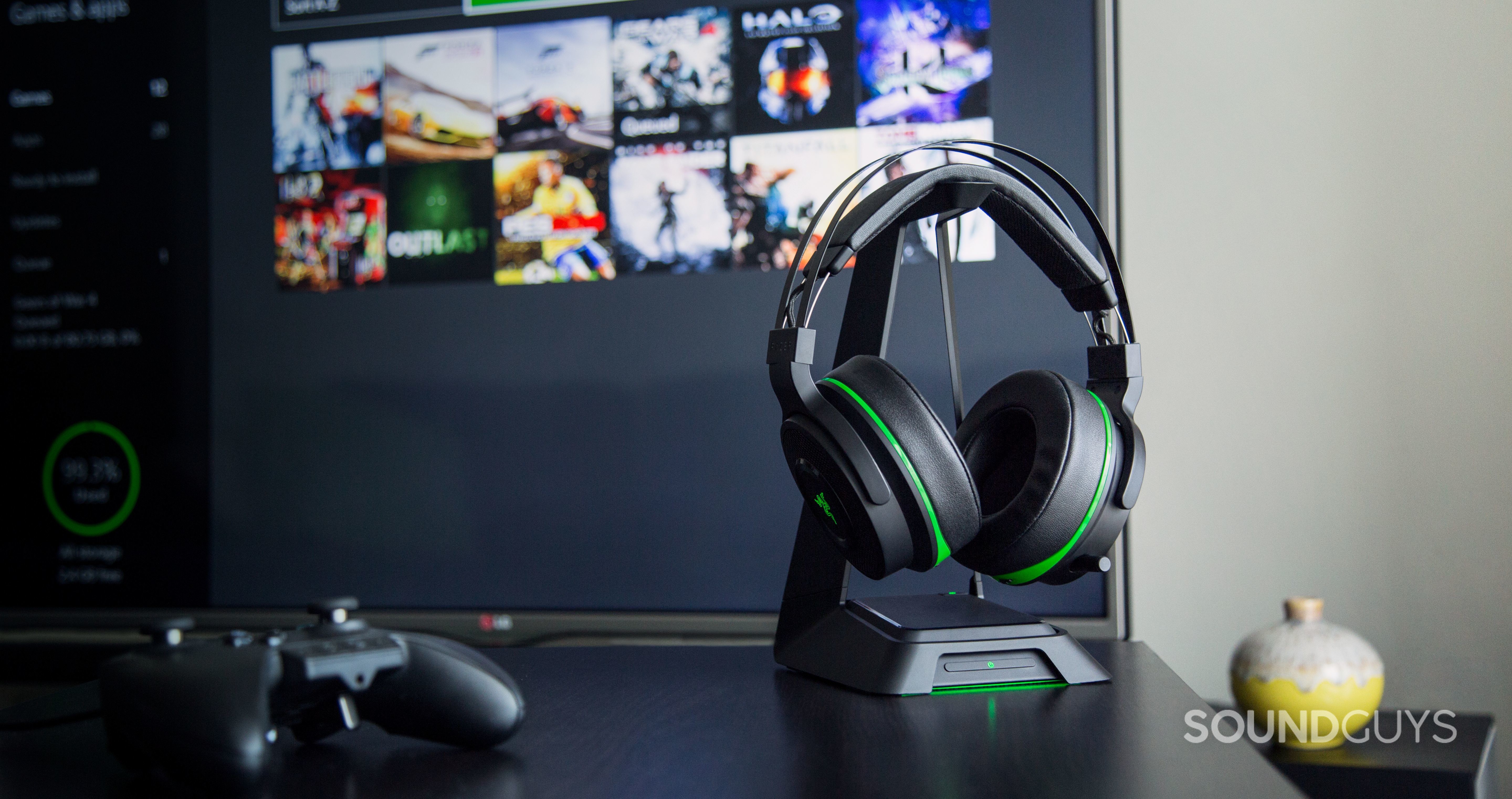 razer-thresher-xbox-one The Razer Thresher headphone pictured alongside an xbox-one and TV.