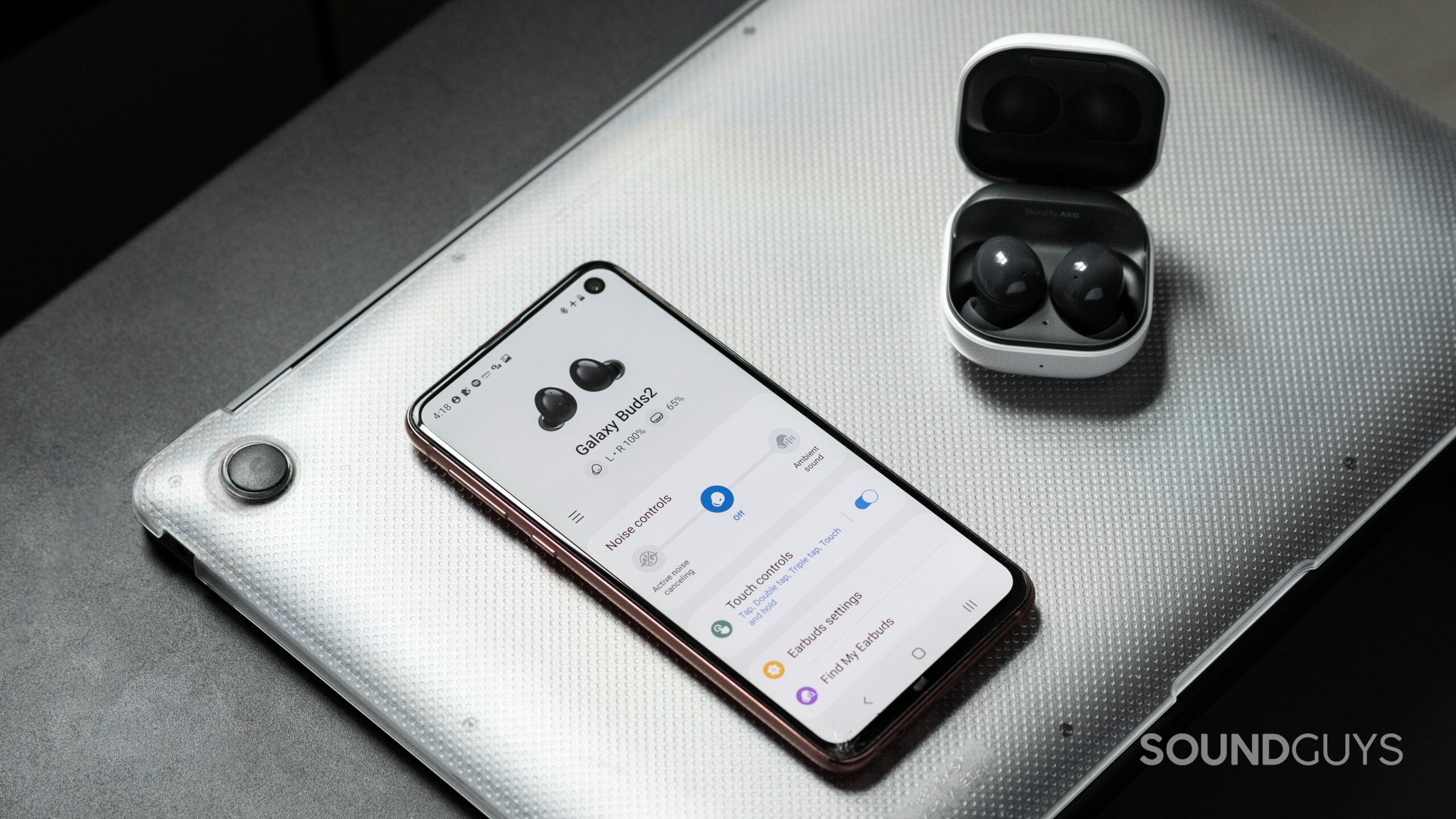 Samsung Galaxy Buds 2-noise canceling true wireless earbuds-8 The Samsung Galaxy Buds 2 noise canceling true wireless earbuds in the open charging case while connected to the Galaxy Wearable app on a Samsung Galaxy S10e.