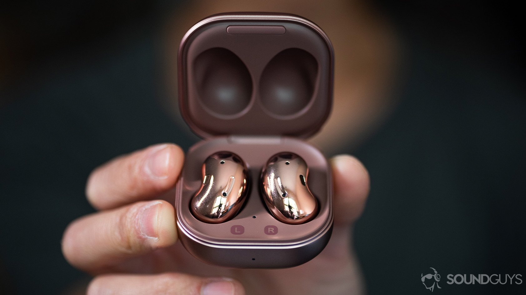 Samsung Galaxy Buds Live noise canceling true wireless earbuds case open handheld 2 A picture of the Samsung Galaxy Buds Live noise canceling true wireless earbuds in the case being held in a hand.