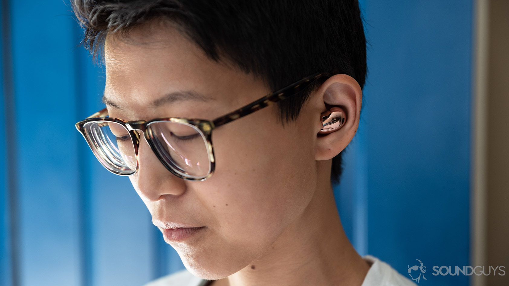 Samsung Galaxy Buds Live noise canceling true wireless earbuds woman wearing close up A close-up picture of a woman wearing the Samsung Galaxy Buds Live noise canceling true wireless earbuds in Mystic Bronze.