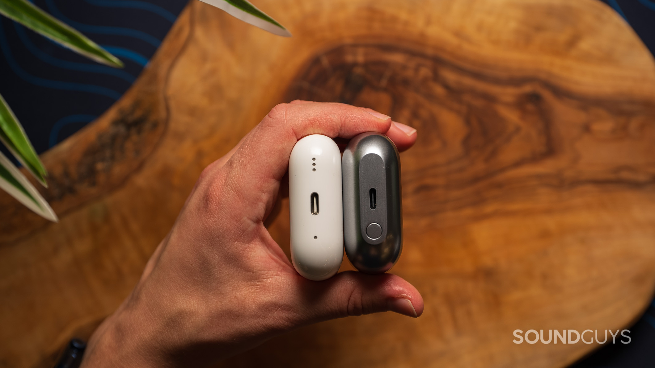 Samsung Galaxy Buds3 Pro vs Apple AirPods Pro (2nd generation) charging port Samsung Galaxy Buds3 Pro next to the Apple AirPods Pro (2nd generation), showing the USB-C charging port on both.