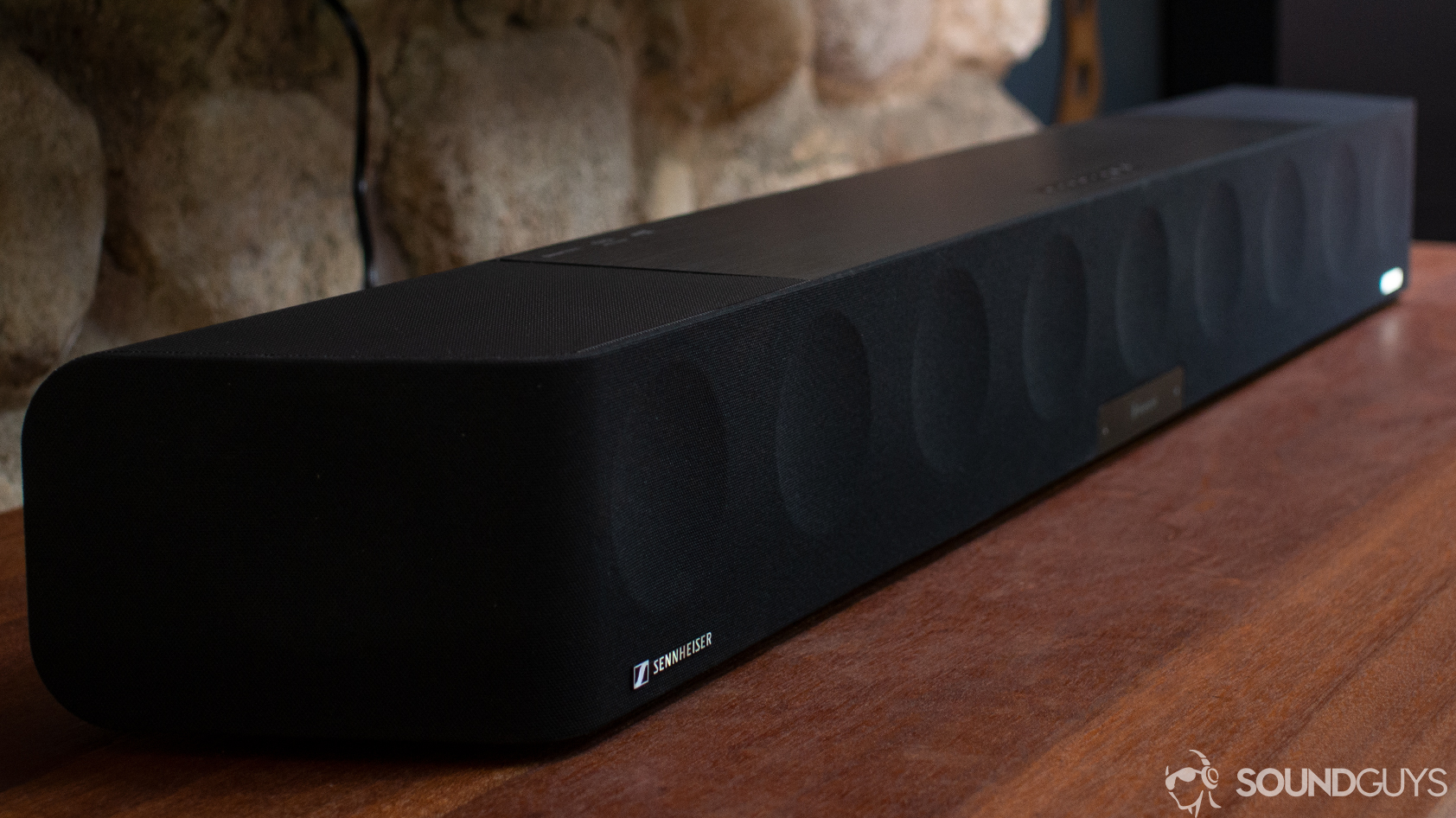 sennheiser-ambeo-soundbar A photo of the Sennheiser Ambeo Soundbar on a wooden desk.