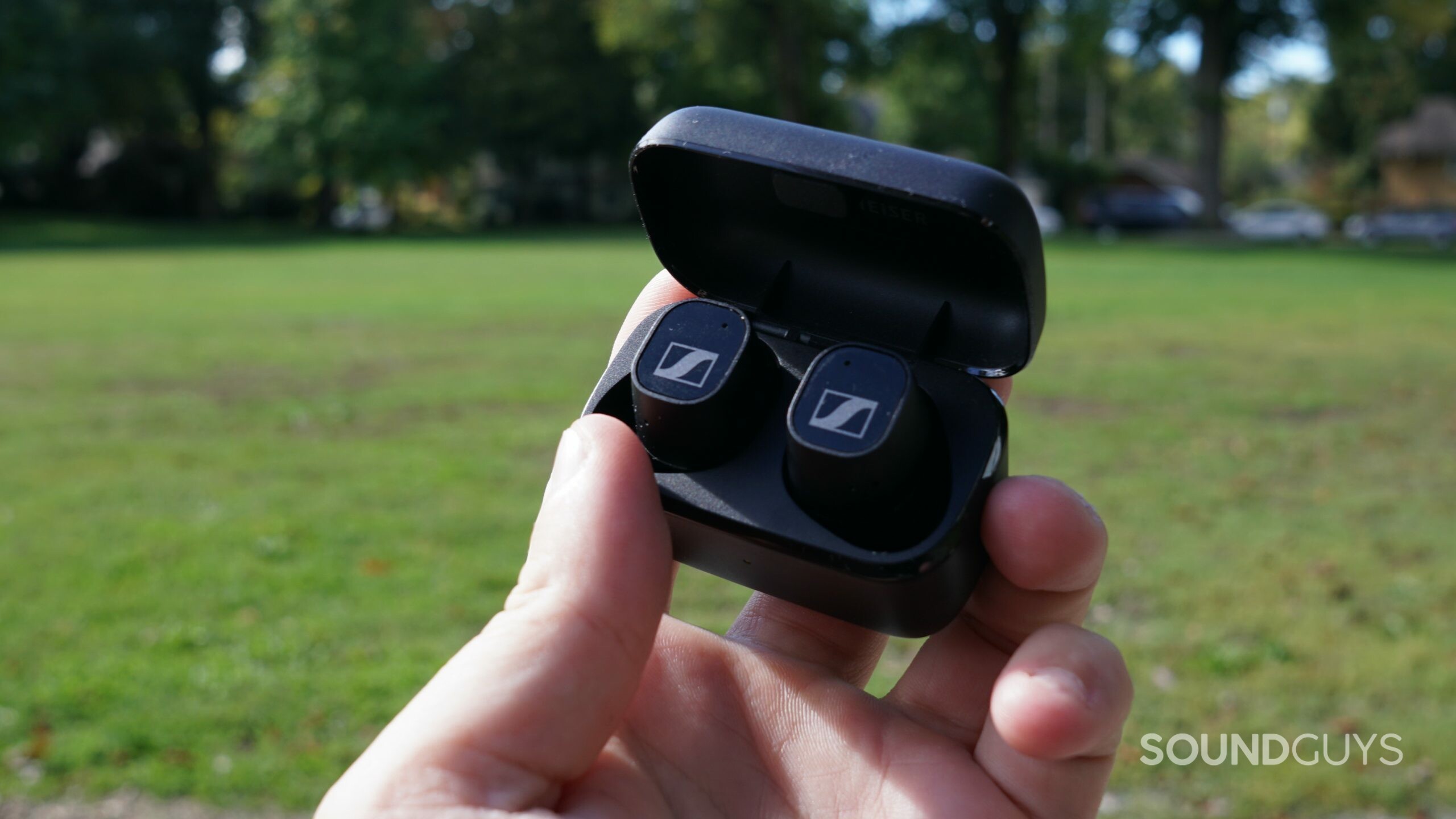 Sennheiser-CX-Plus-TWS-in-case-outdoors The Sennheiser CX Plus True Wireless is held outside, sitting in its case.