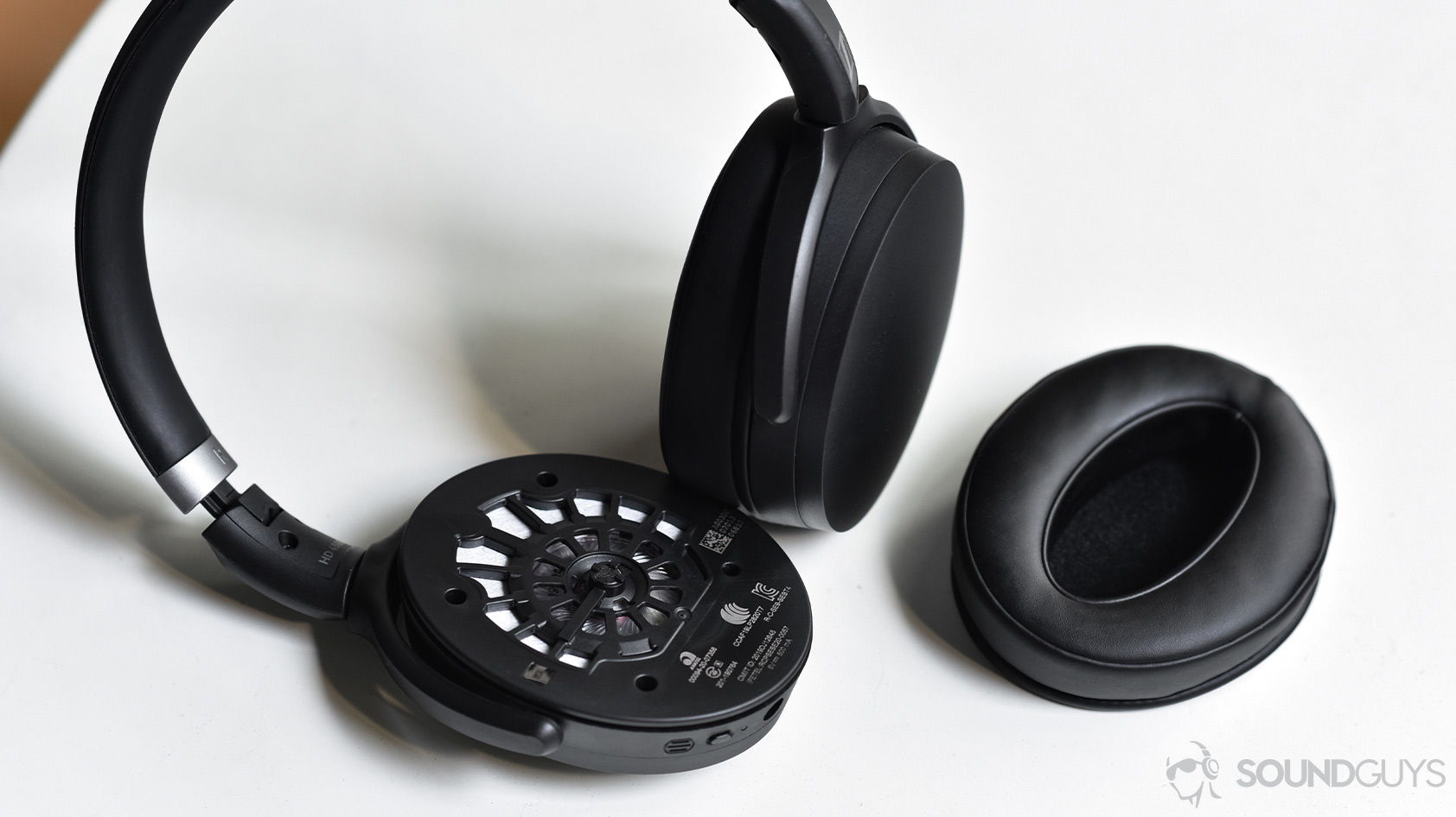 Sennheiser HD 450BT-noise canceling headphones removable ear pads The Sennheiser HD 450BT noise canceling headphones with the right ear pad removed to reveal the dynamic driver.