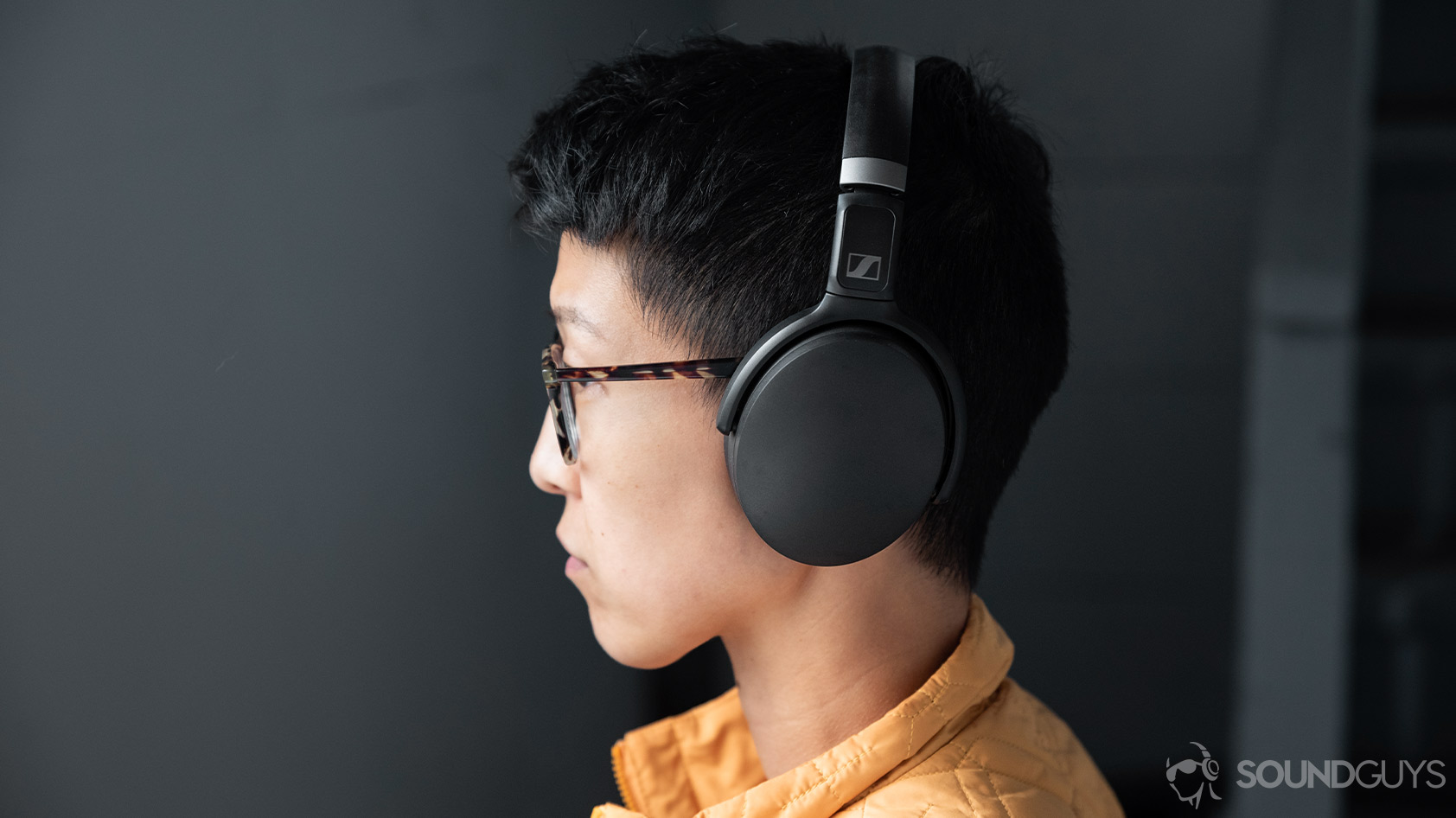Sennheiser HD 450BT-noise canceling headphones wearing woman A picture of the Sennheiser HD 450BT noise canceling headphones worn by a woman in profile to depict the ear cup size.