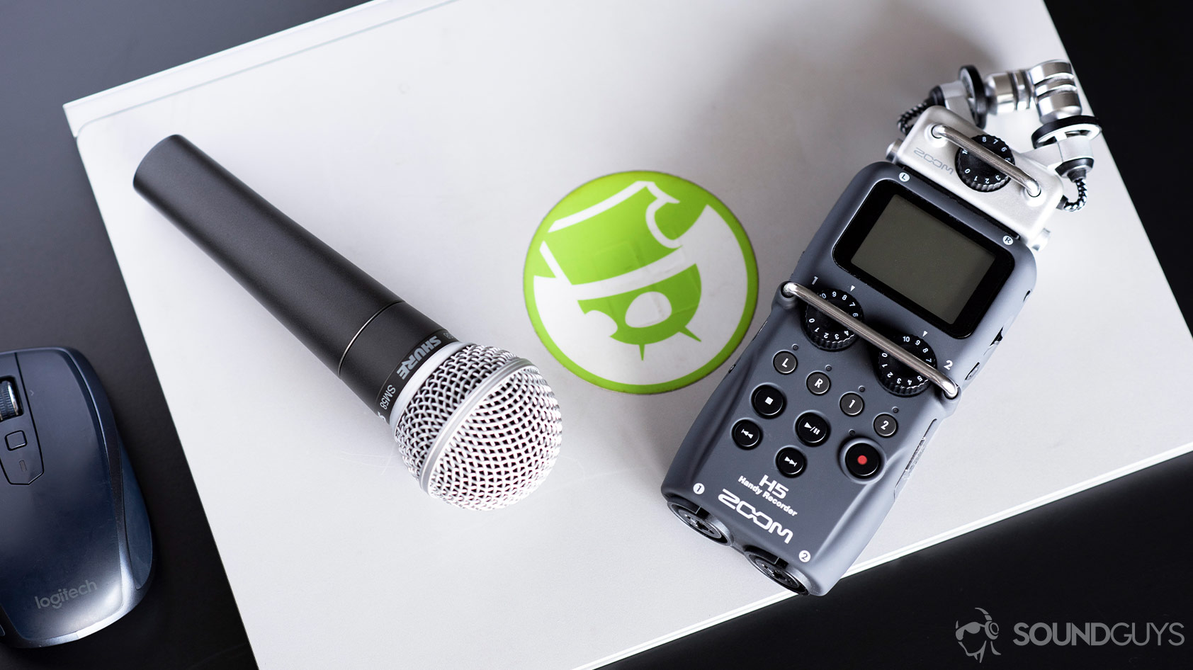 Shure SM58-1_aerial XLR microphone Zoom H5 voice recorder Shure SM58 microphone next to a Zoom H5, one of the best voice recorders.