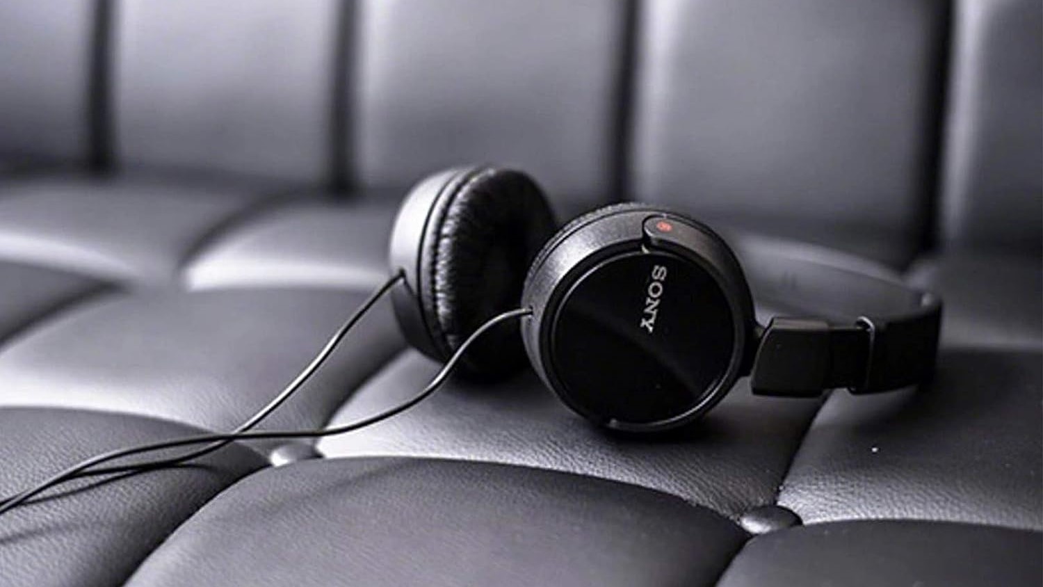 Sony MDR-ZX110AP sony headphones laying on the couch
