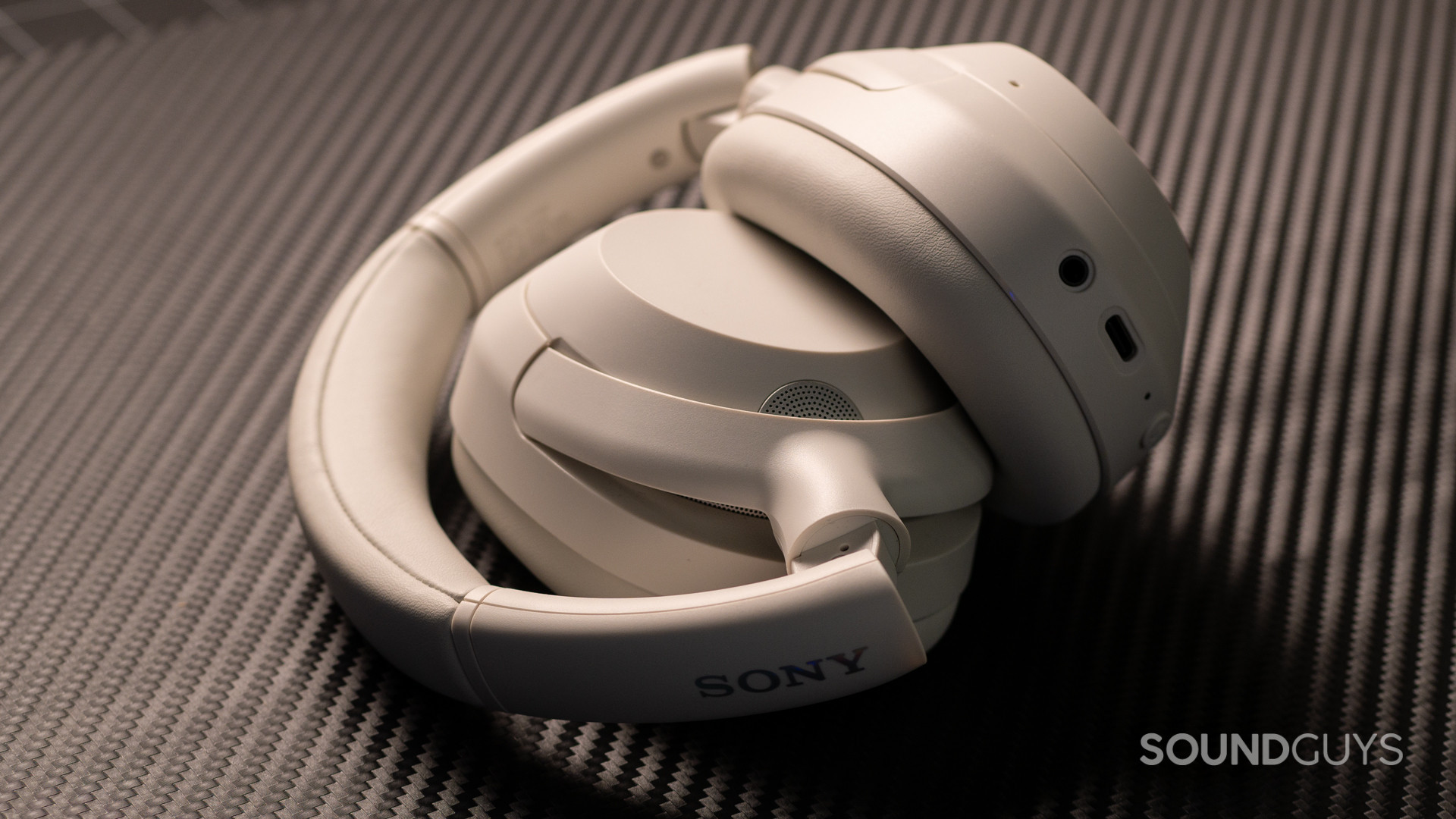 sony-ult-wear-foldup A photo of the Sony ULT WEAR headphones, foleded up atop a desk.