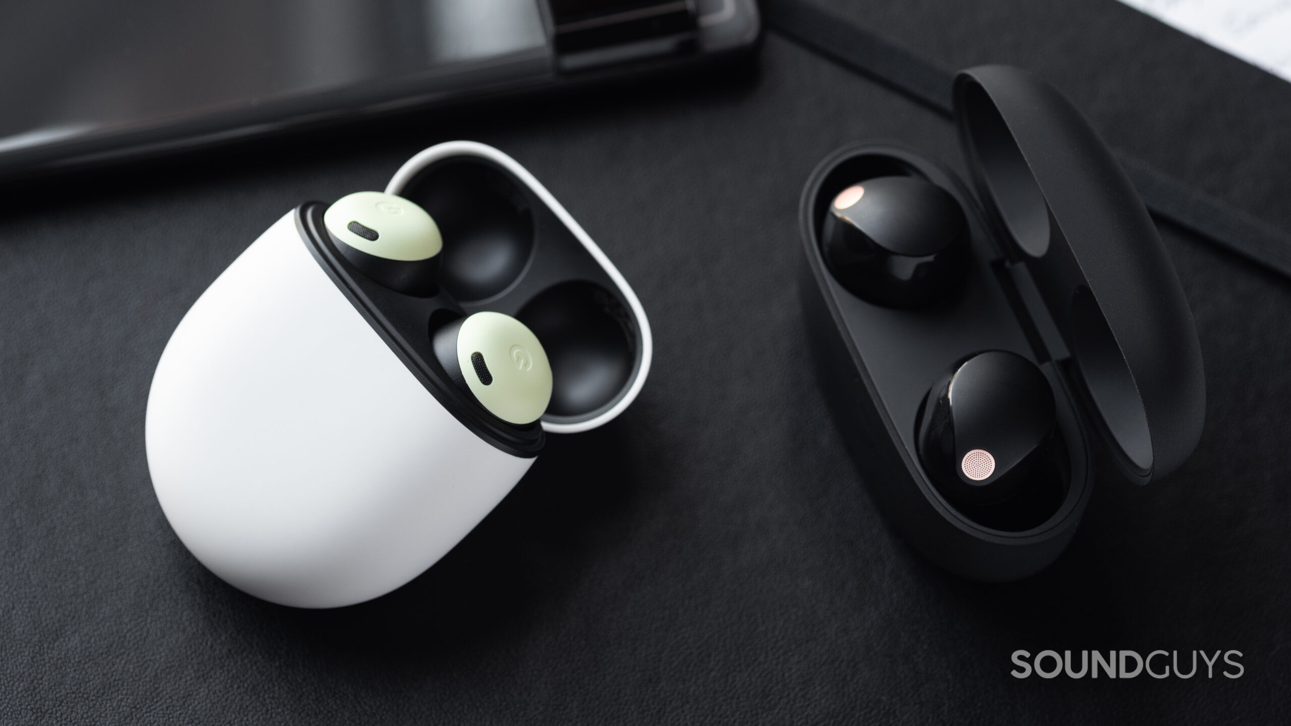 Sony WF-1000XM5 vs Google Pixel Buds Pro-1 The Google Pixel Buds Pro and Sony WF-1000XM5 right next to each other.