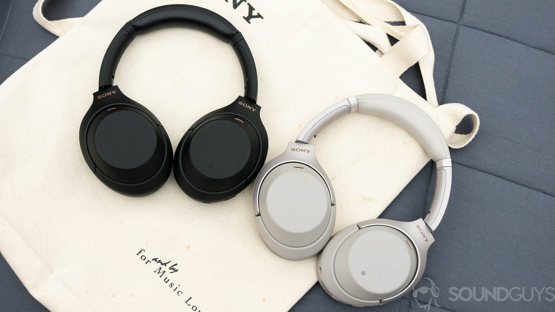 Sony WH-1000XM4 (1 of 4) The Sony WH-1000XM4 and Sony WH-1000XM3 headphones sit on a canvas bag next to eachother.