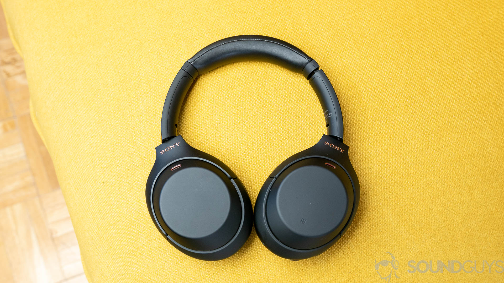 Sony WH-1000XM4 design Sony WH-1000XM4 headphones on a yellow couch